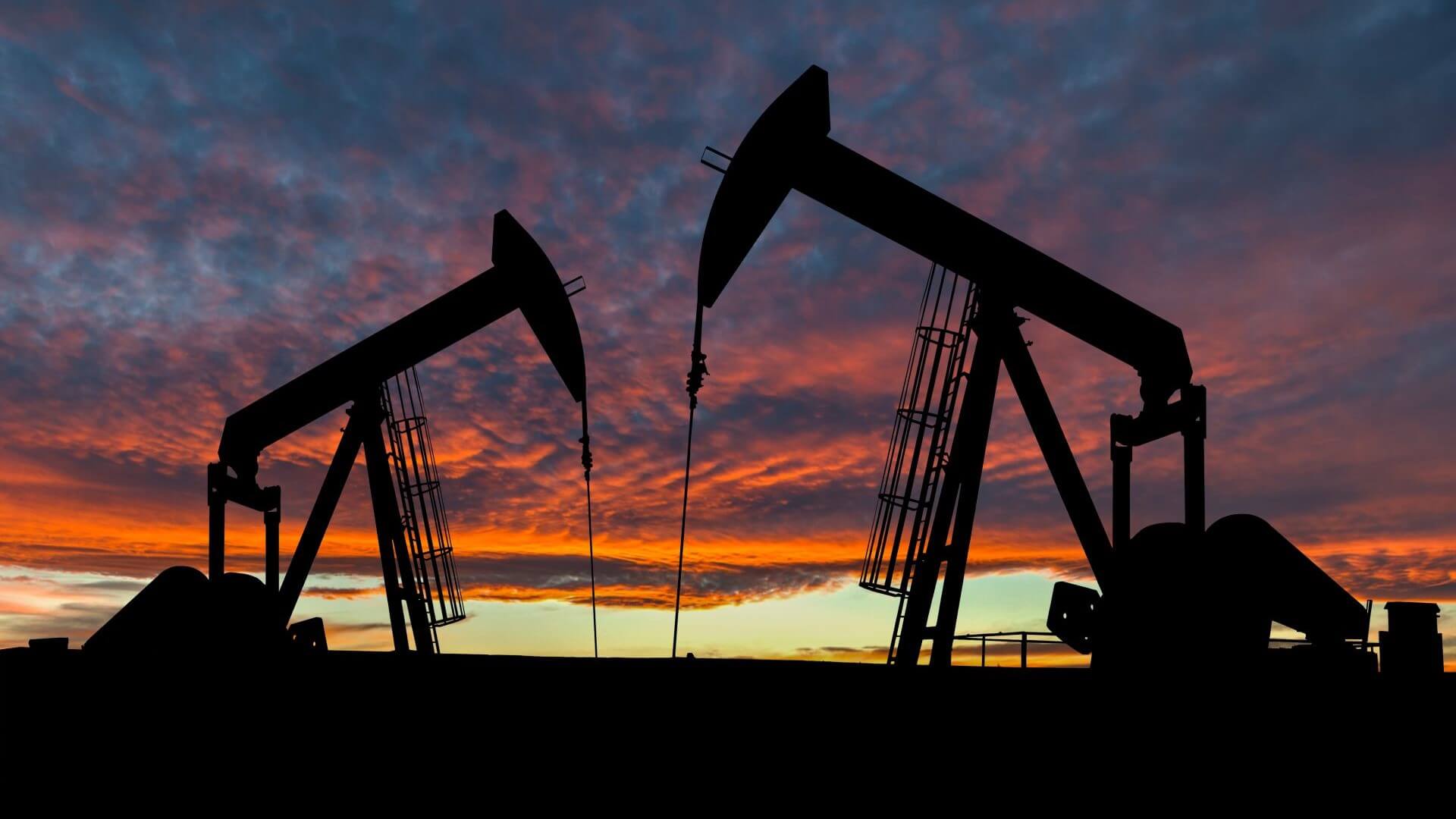 two oil nodding donkeys at sunset