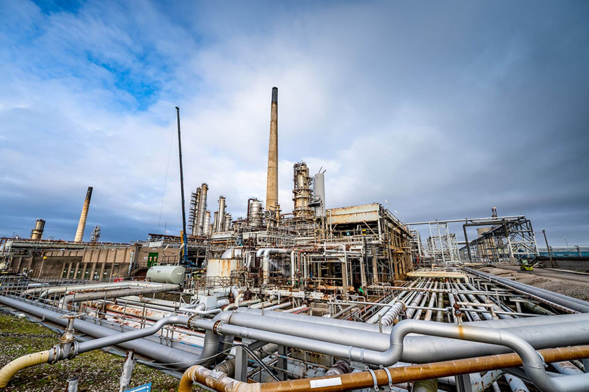 Stanlow refinery facility with pipework in foreground