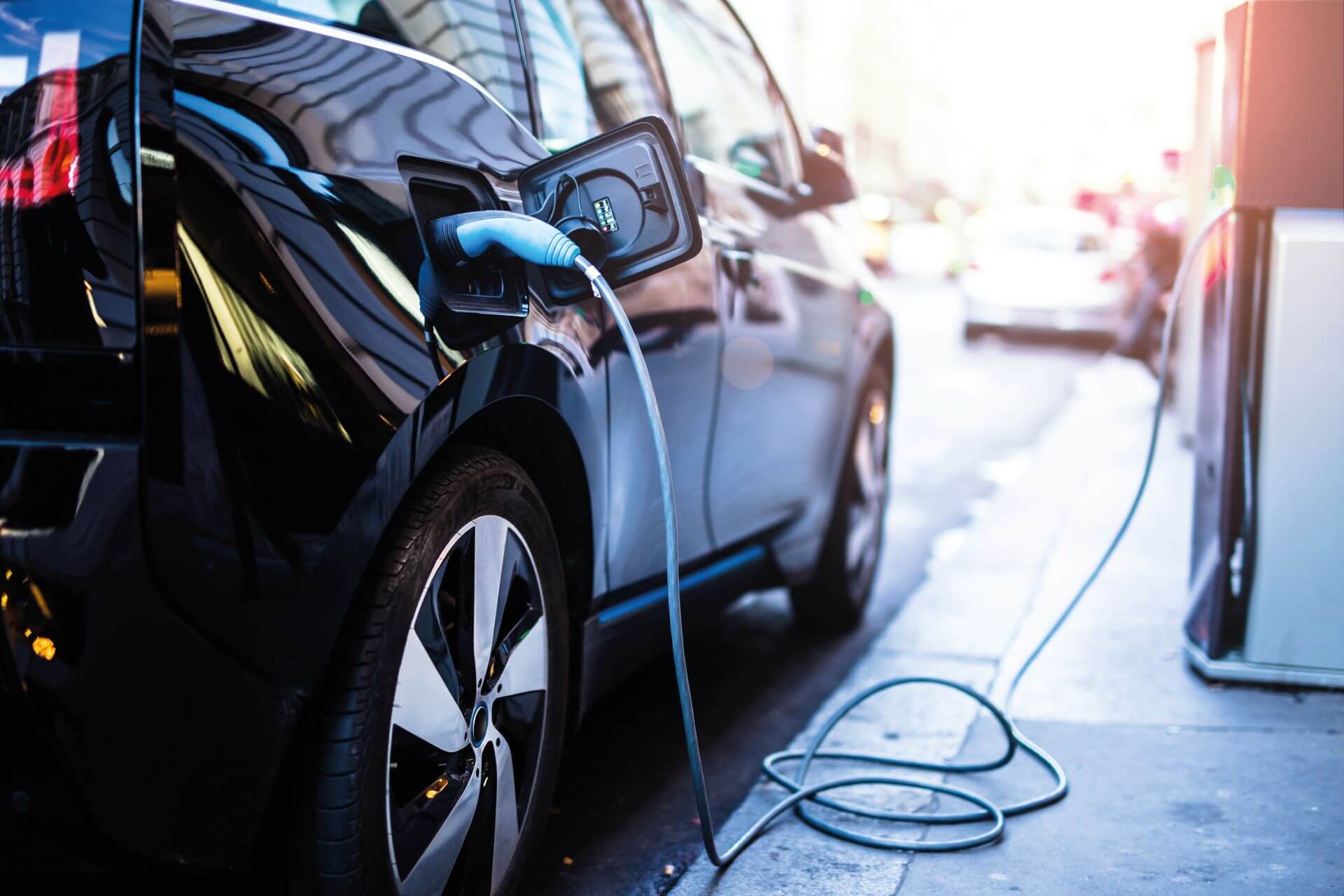 electric vehicle plugged into charging unit