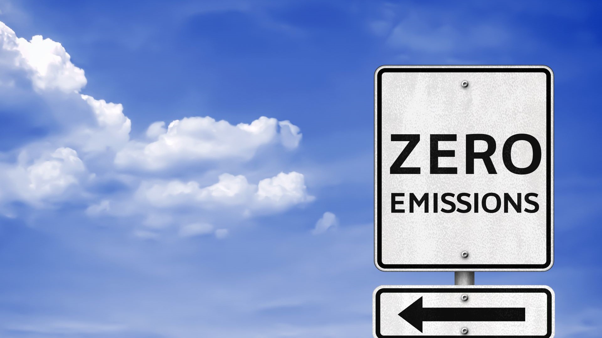 graphic of zero emissions sign and arrow set against blue sky