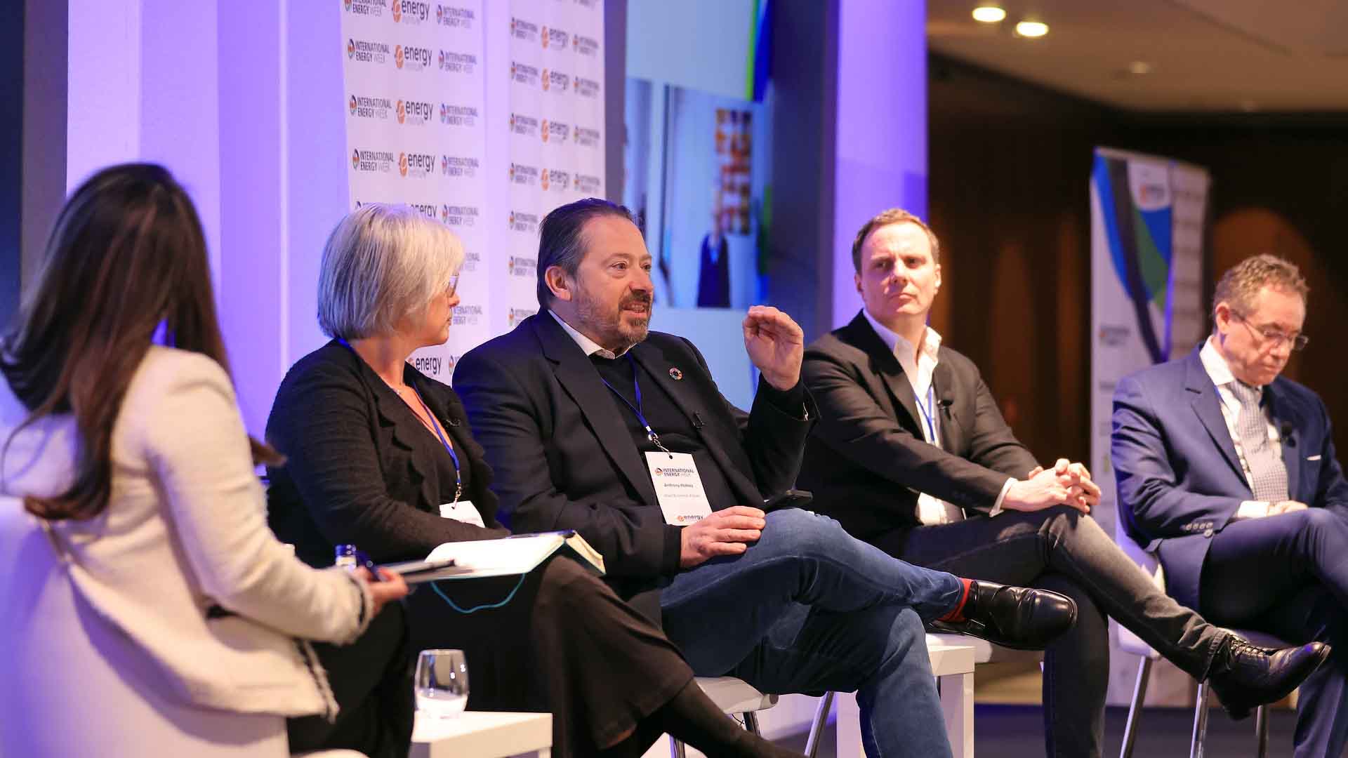 International Energy Week 2022 panellists sitting on seats on stage