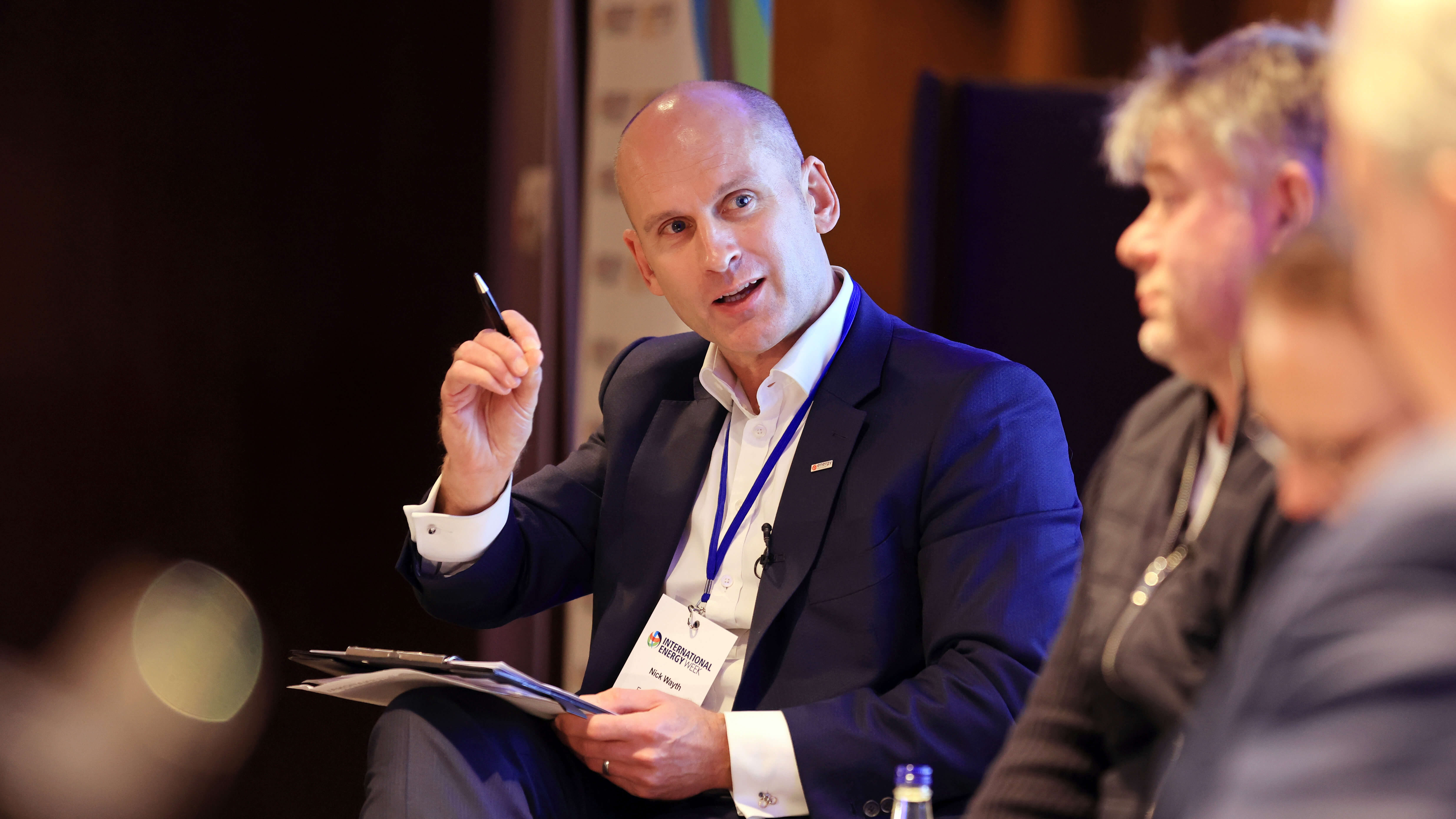 EI CEO, Nick Wayth sat on stage, talking at International Energy Week 2022