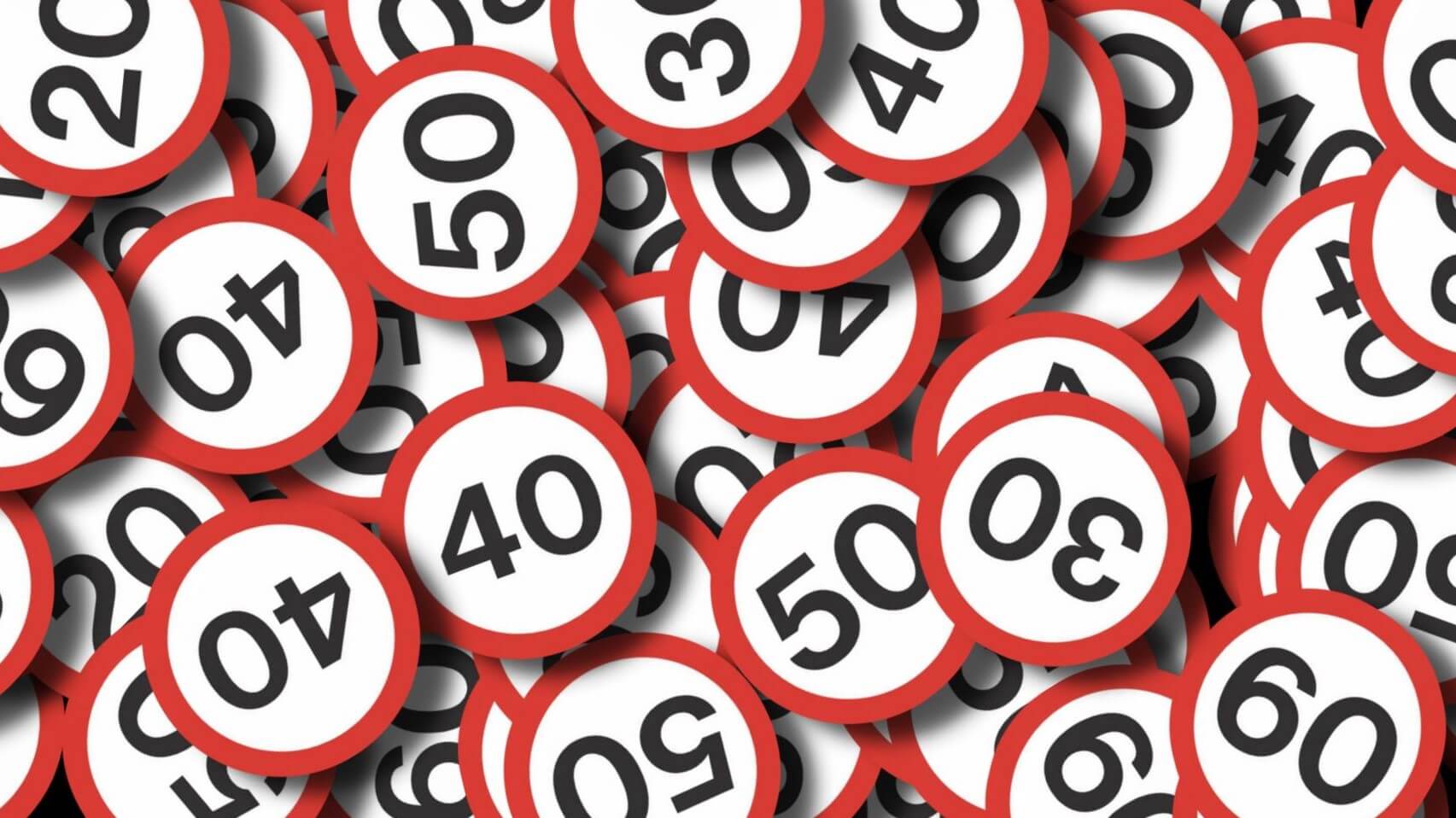 Graphic of lots of round speed limit signs jumbled up in a pile