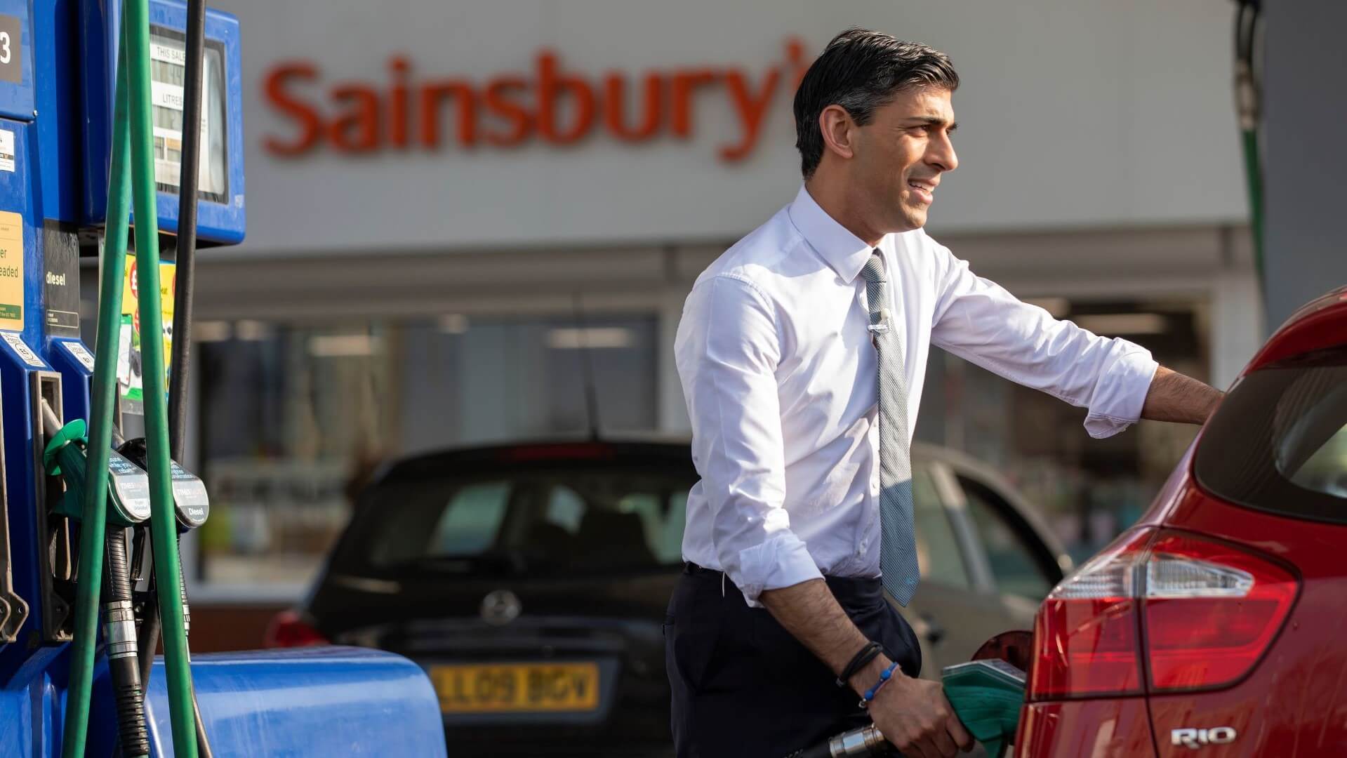 UK Chancellor Rishi Sunak filling up a car with petrol