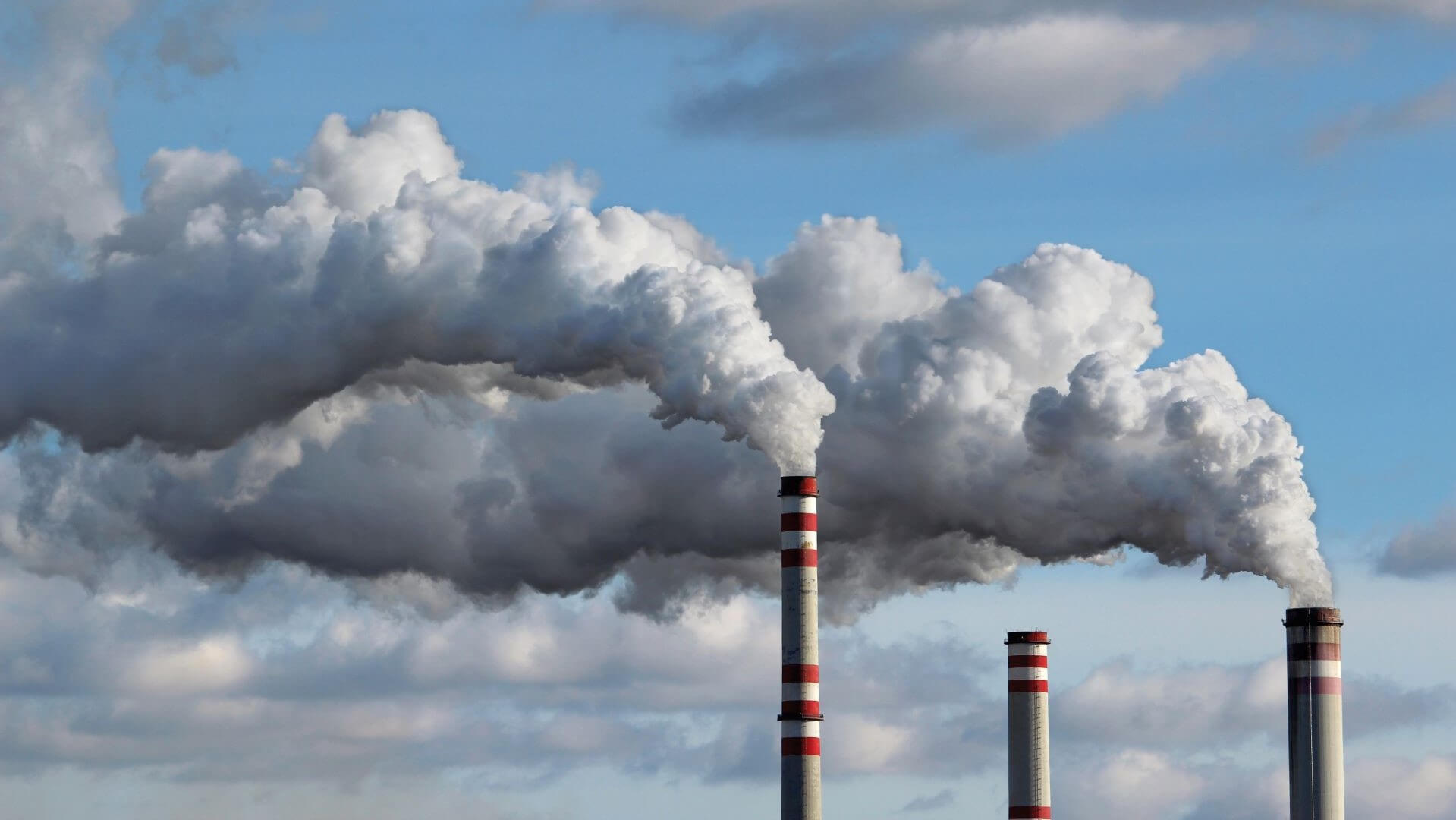Smoke from three chimneys 