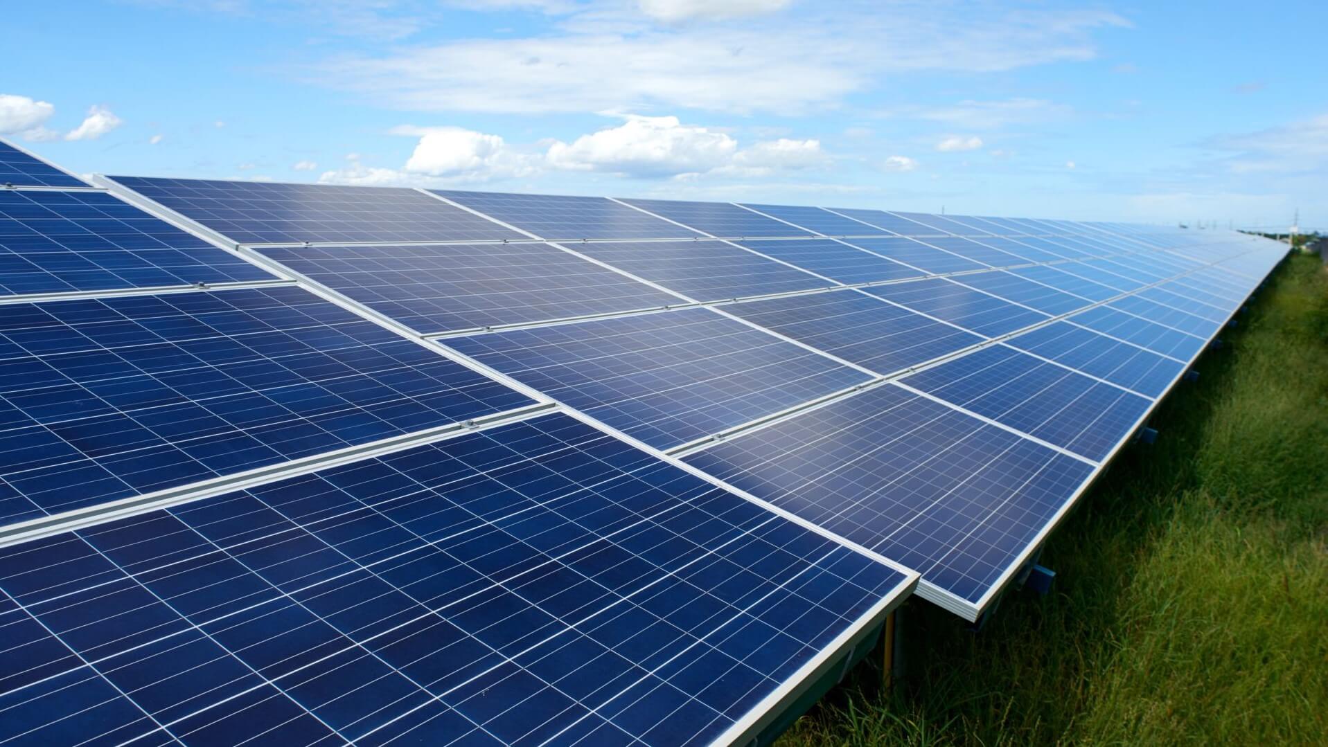 Close up of solar panels in grass field