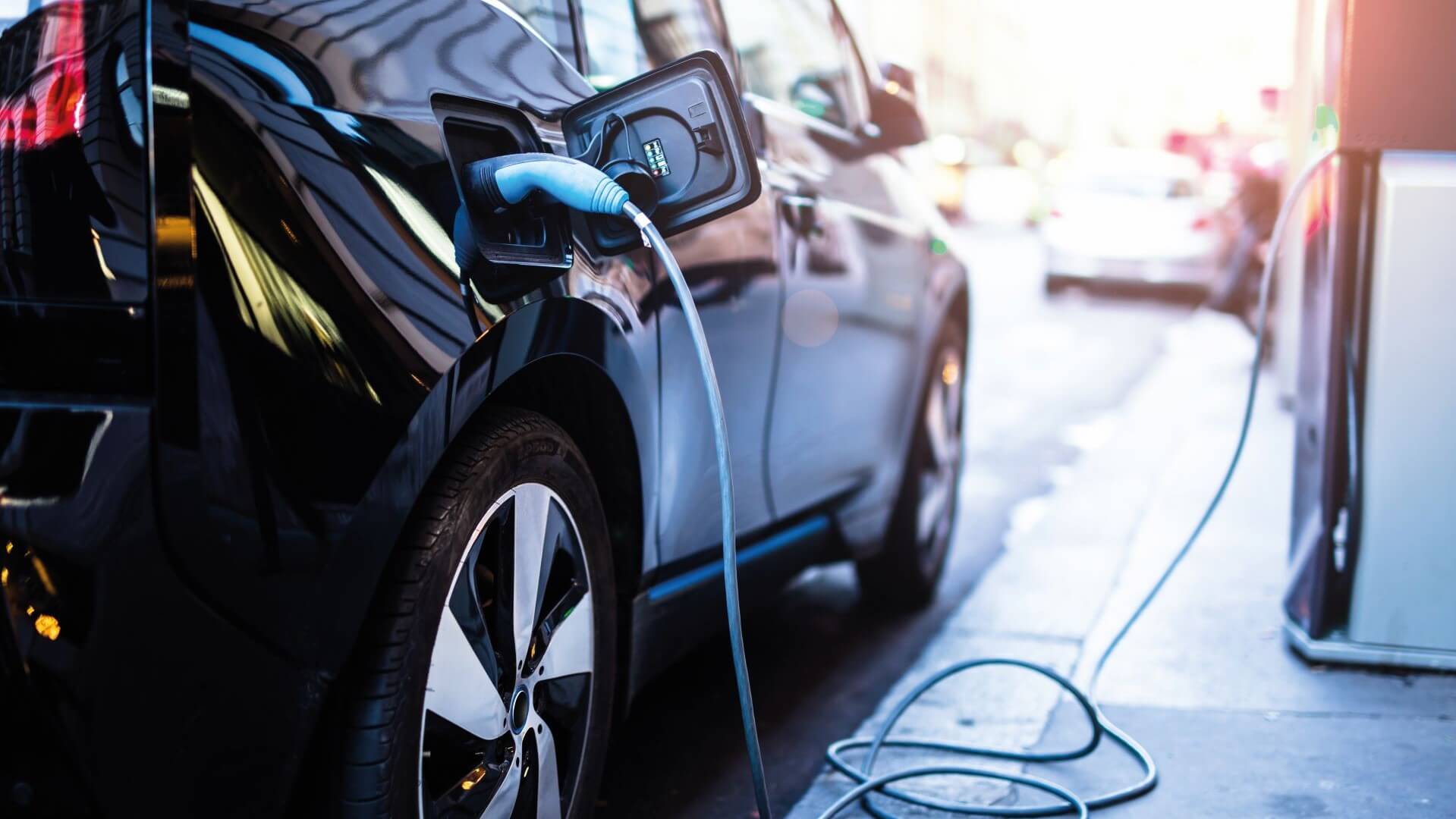 Black EV charging at an on-street charging point