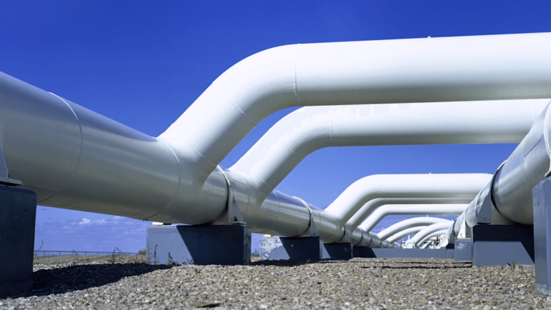 White gas pipelines with a background of blue sky