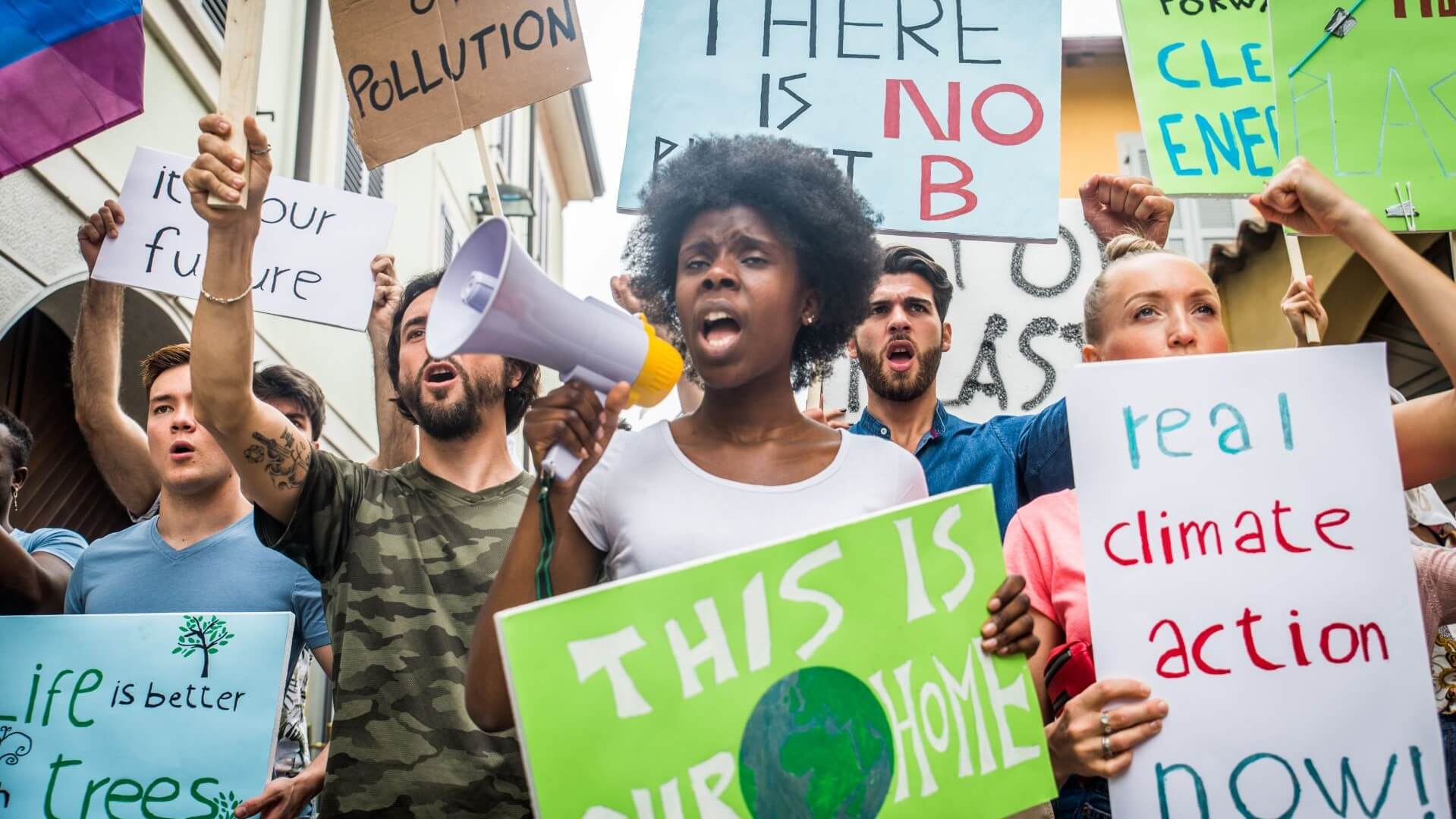 activists protesting with banners on the street