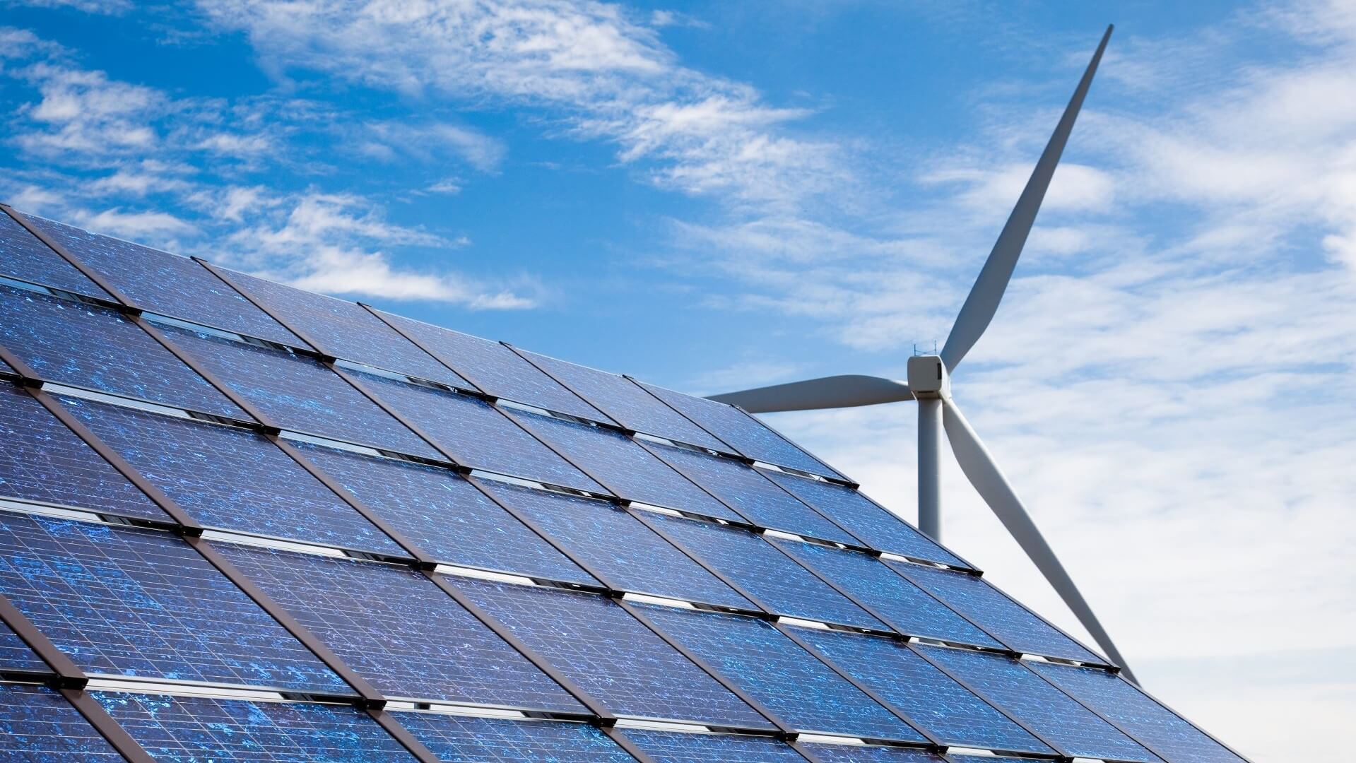 Wind turbine and solar panel close up