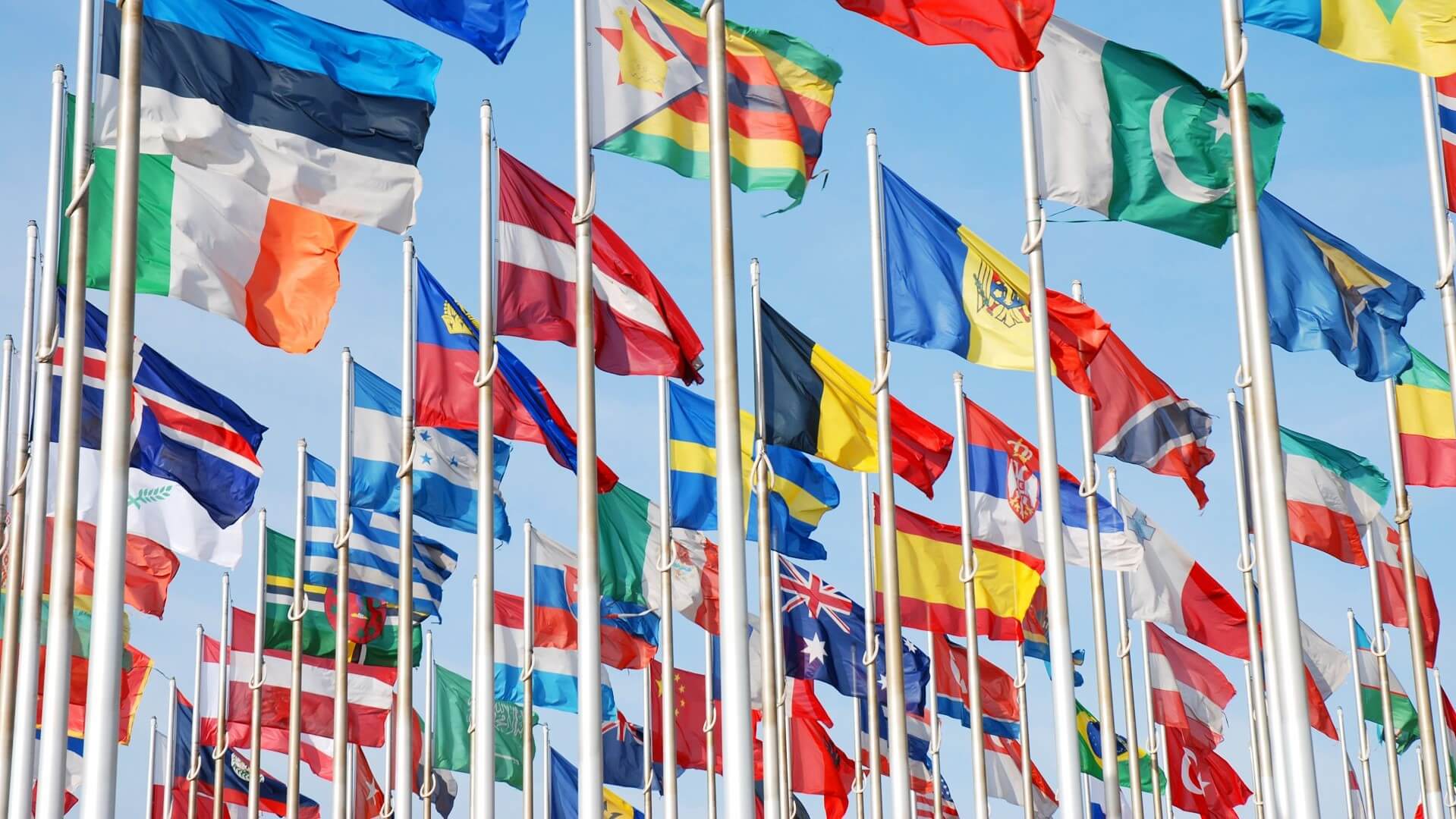 Group of flags flying from various countries