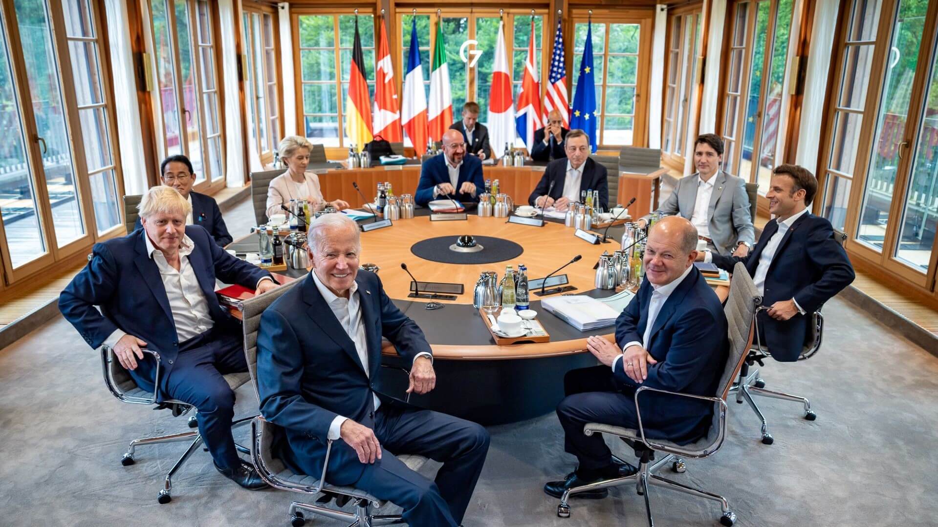 G7 leaders sat around a table in a meeting room