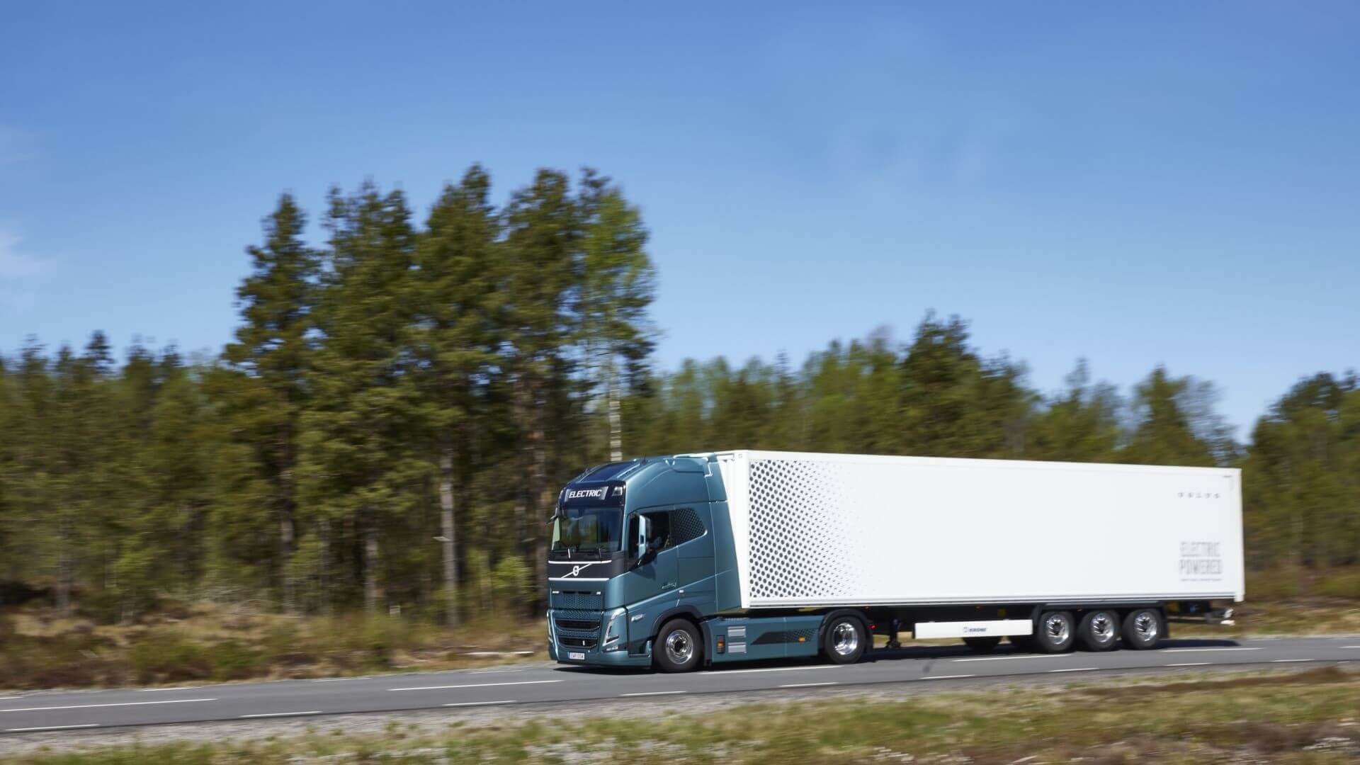 Electric truck driving along road