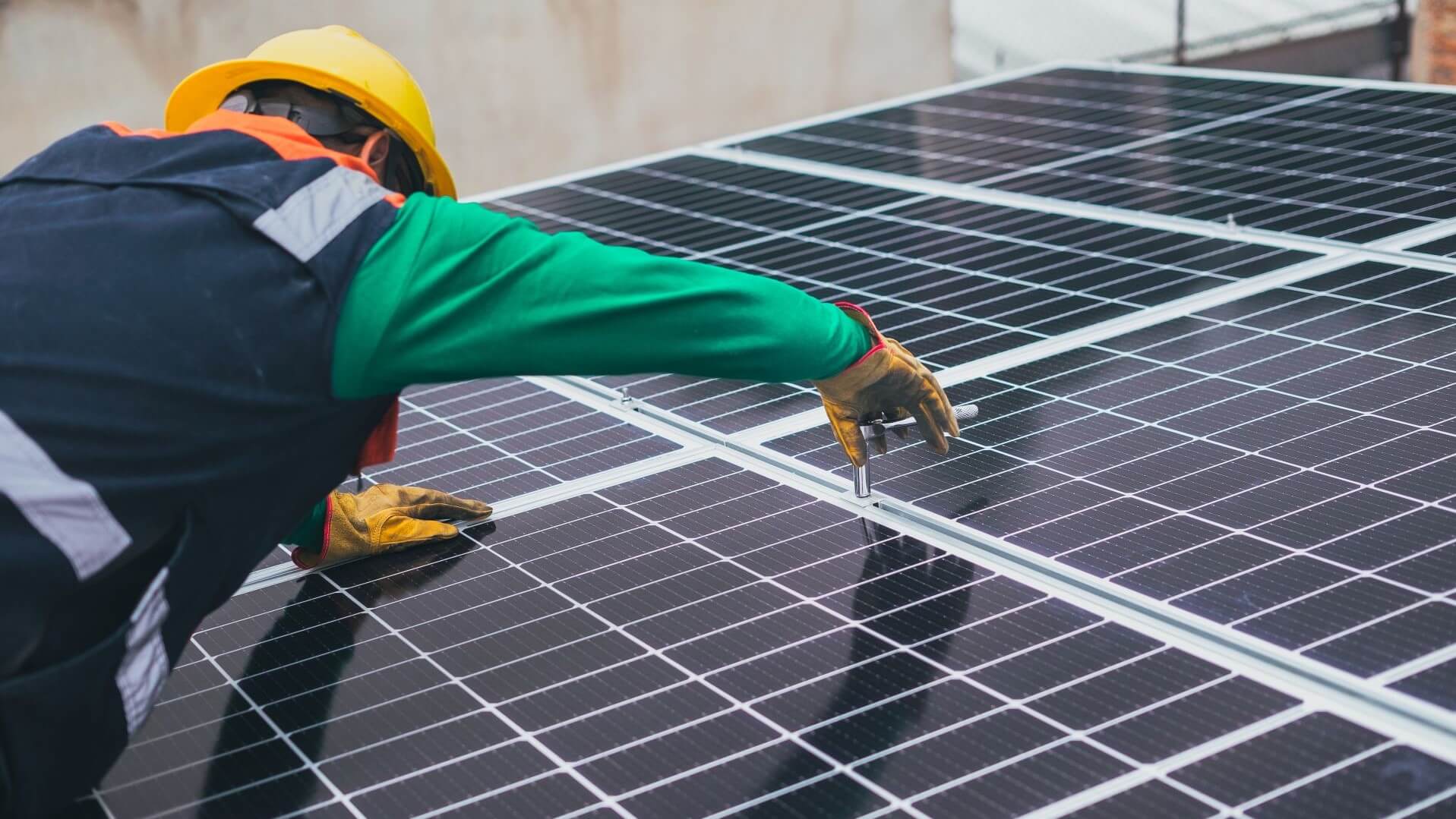 An engineer installing solar PVs