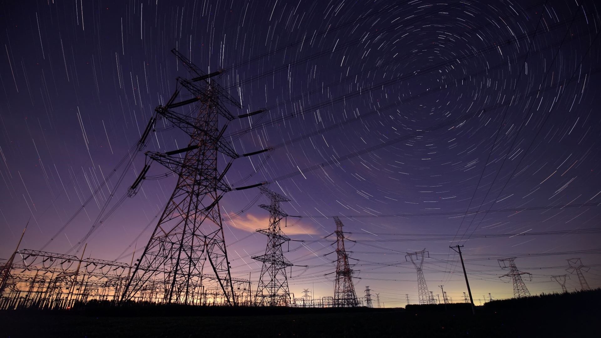Pylons at dusk with a darkening sky