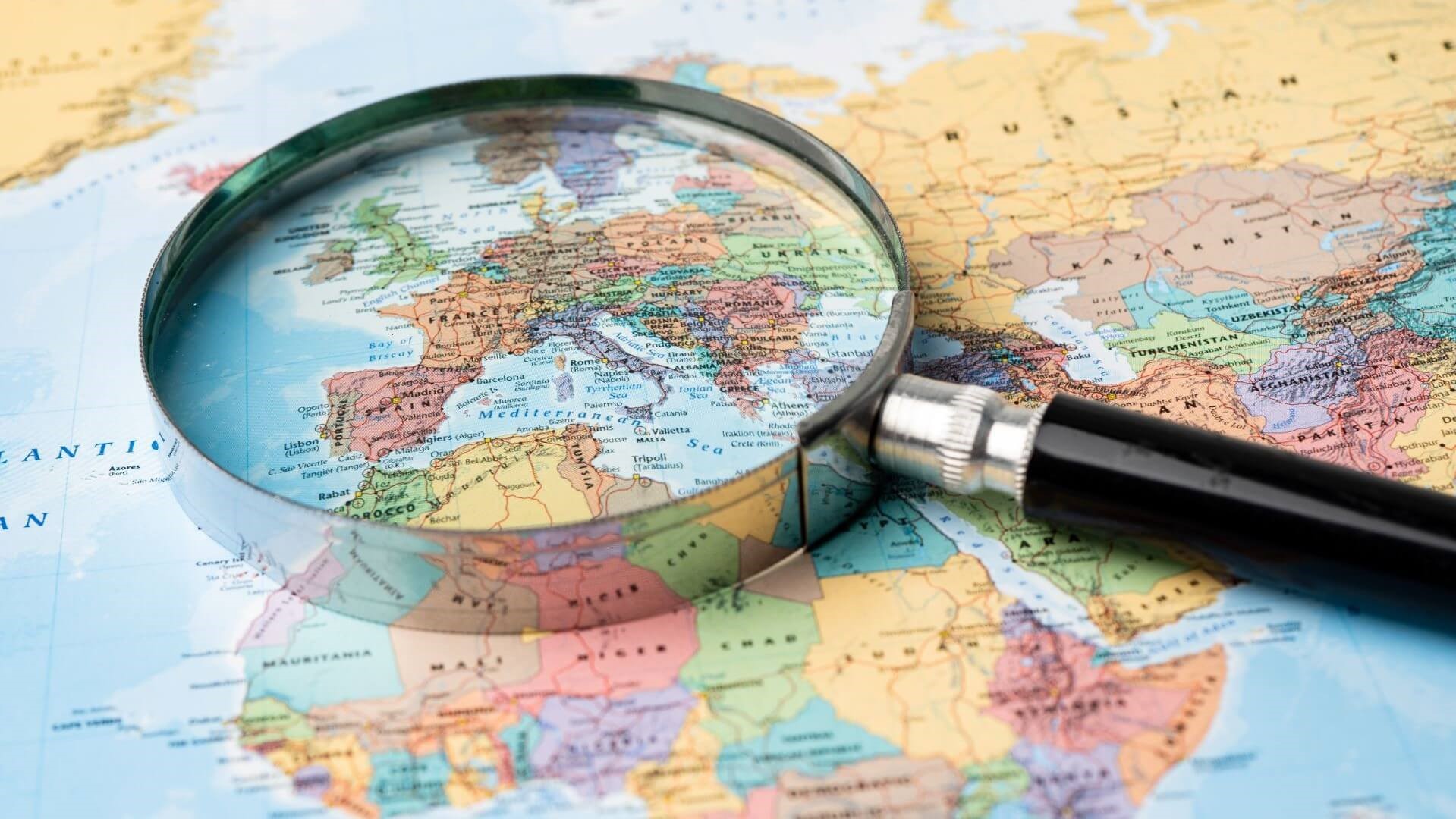 Map with magnifying glass providing focus over Europe