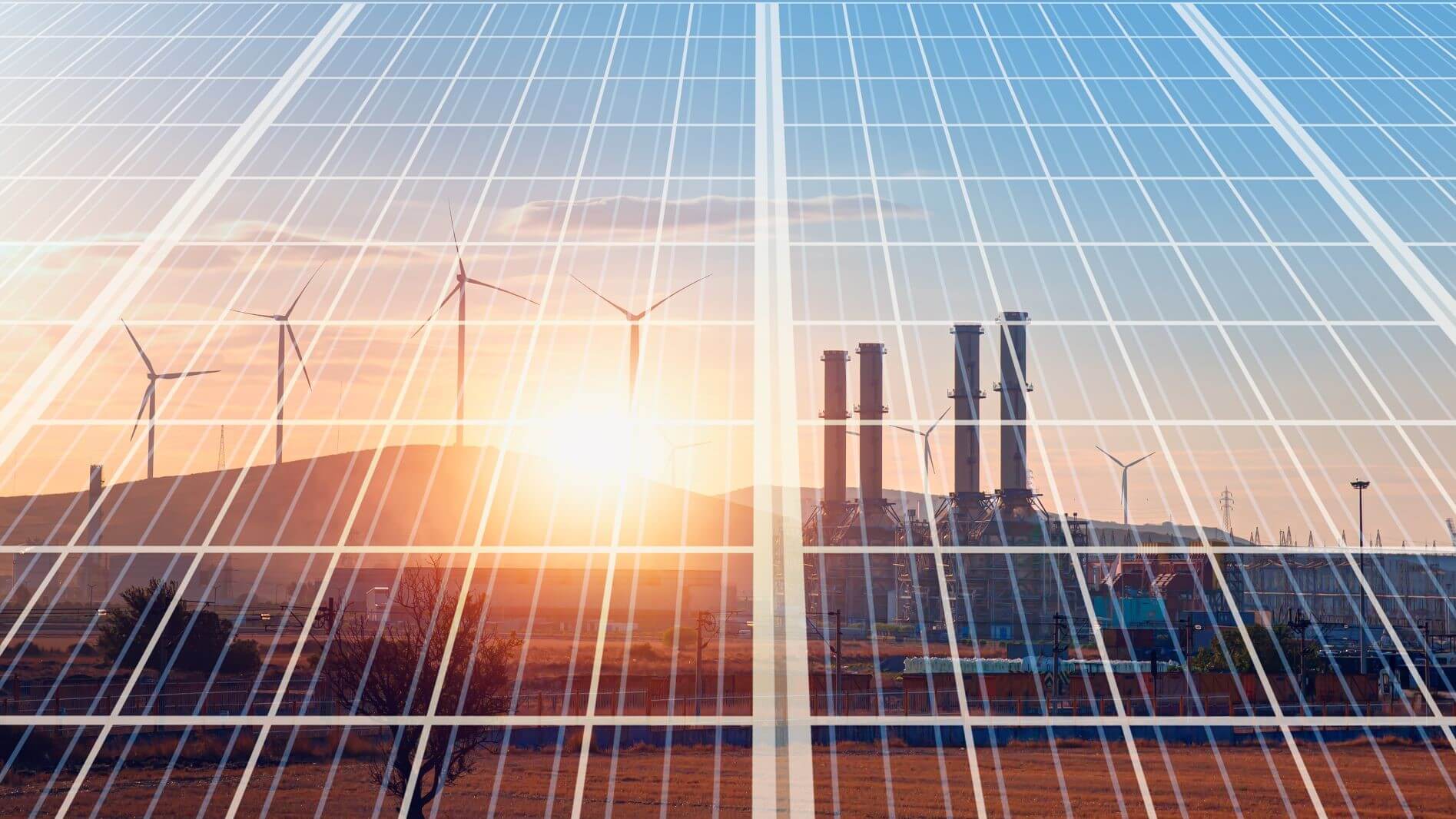 Wind turbines and gas plant reflected in solar panel