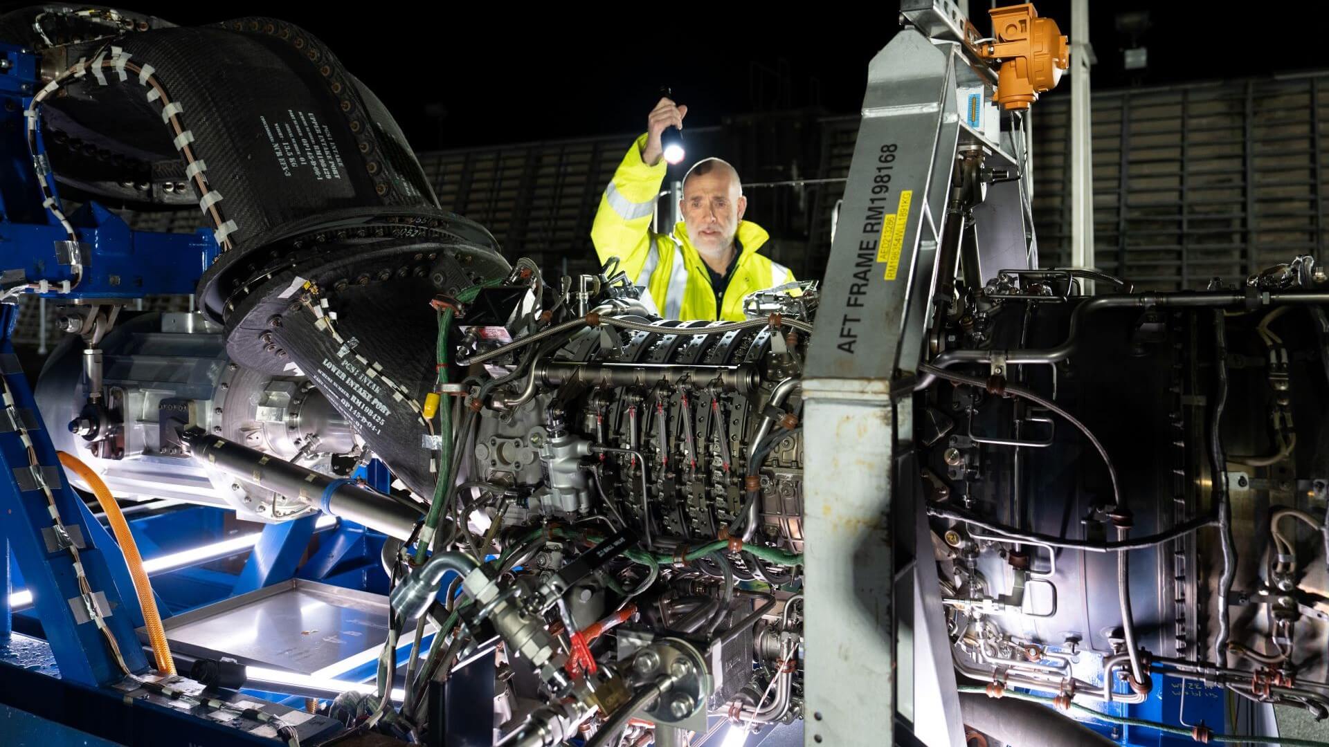 Engineer checking aircraft engine
