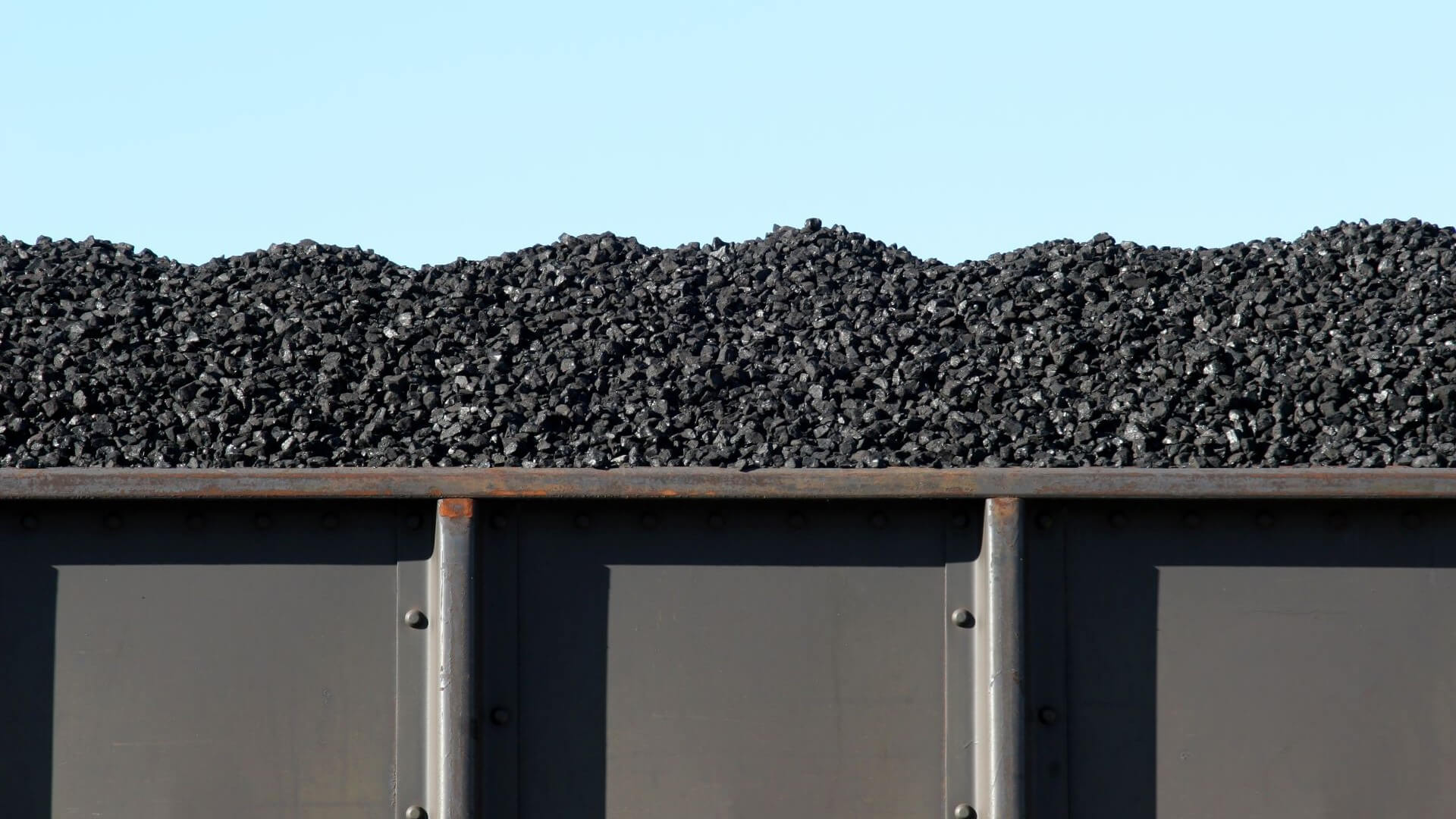 Coal piled high in container