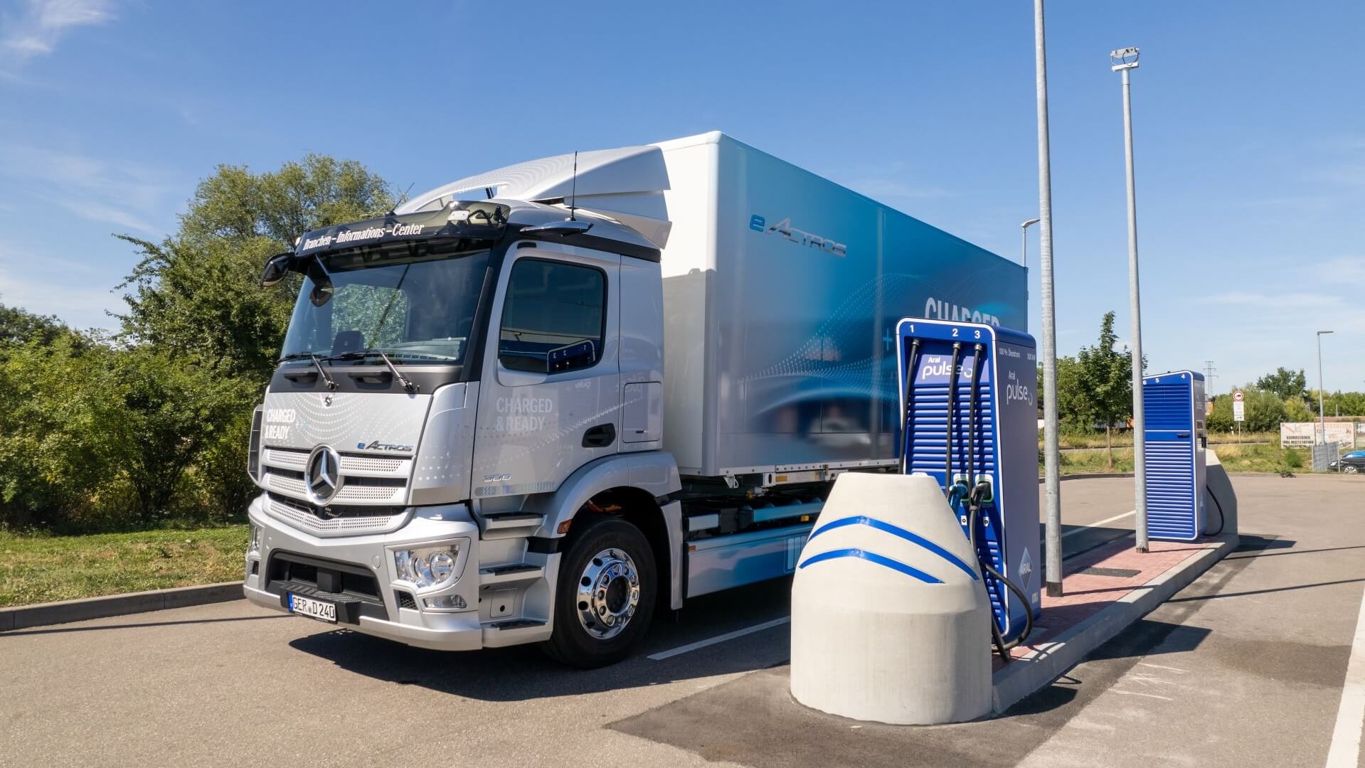 Electric truck charging at charging point