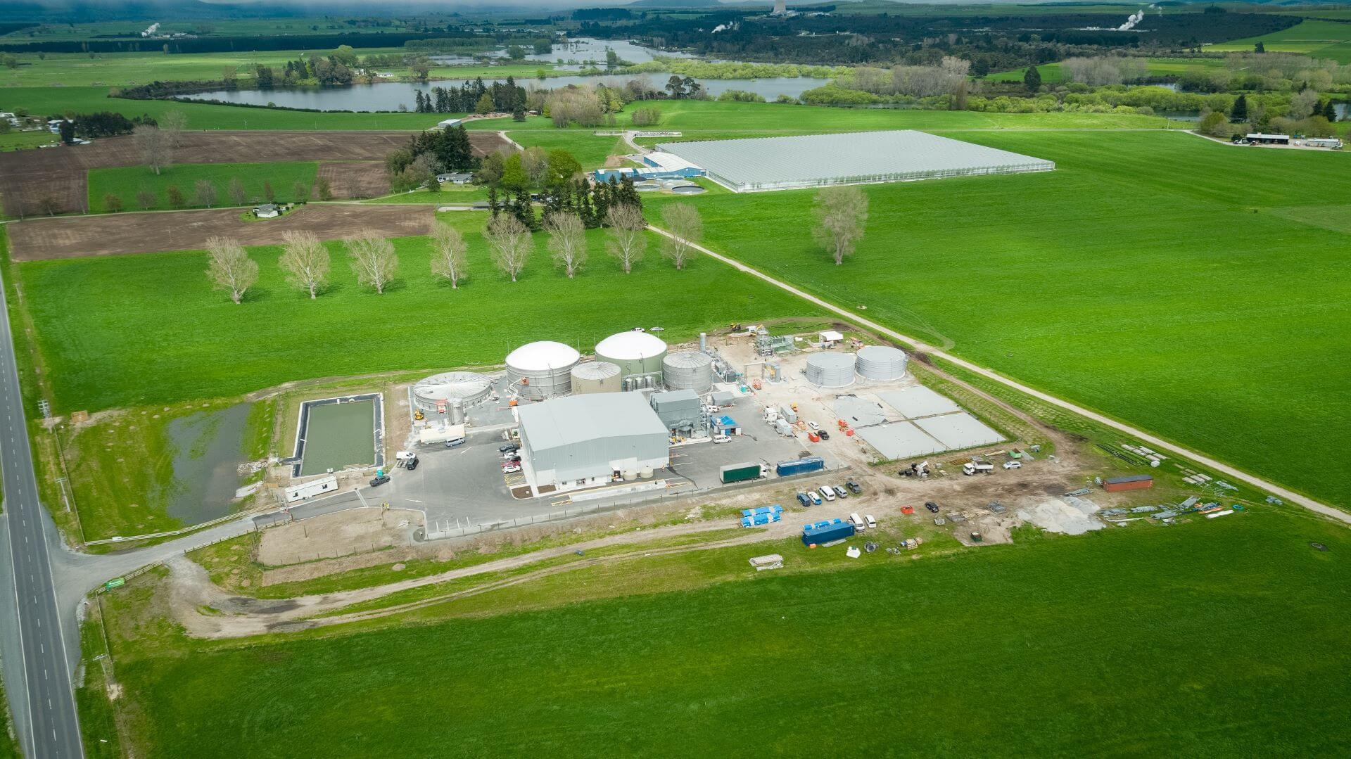 Aerial overview of new Ecogas food waste anaerobic digestion facility surrounded by green fields in New Zealand