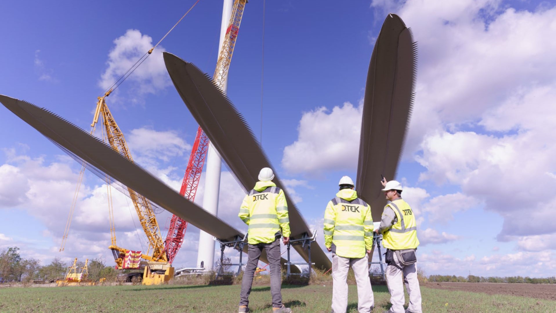Engineers overseeing construction of wind turbines in Ukraine