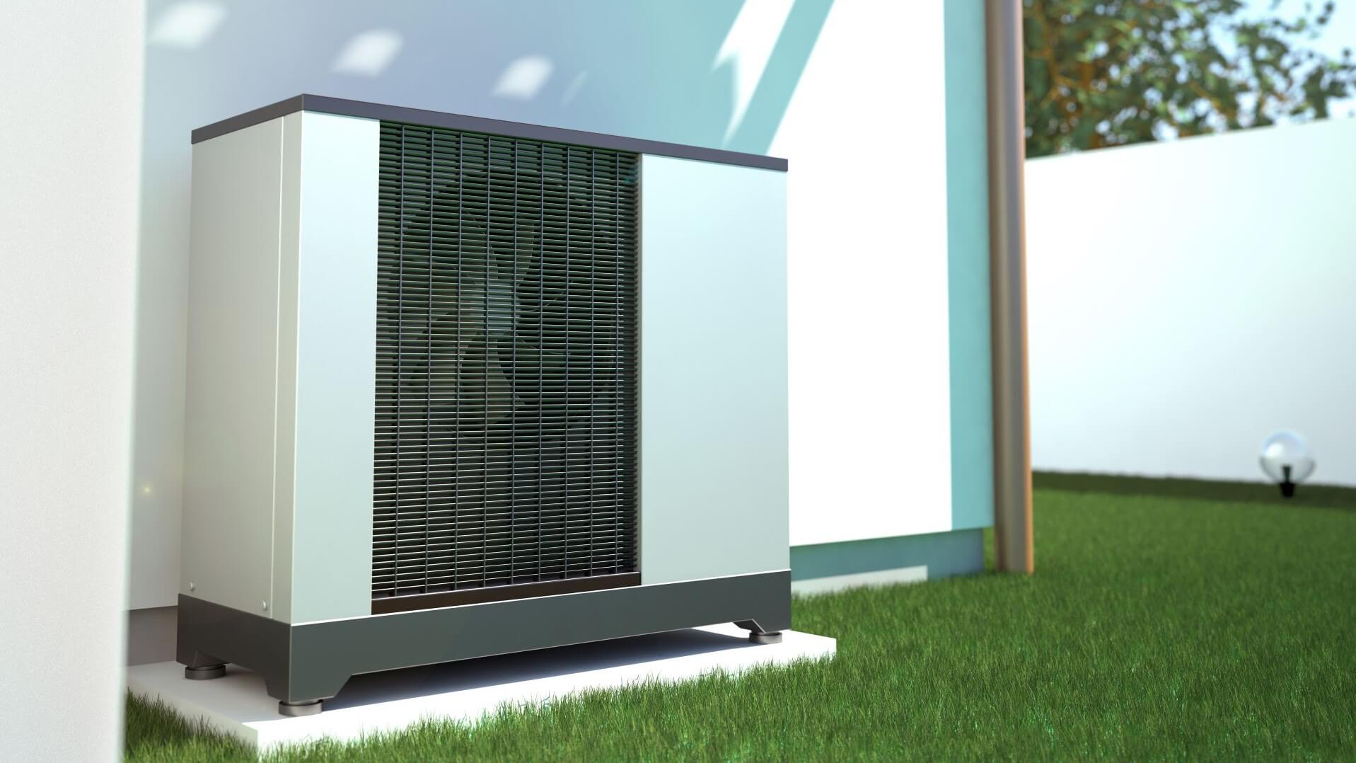Close up of air-to-heat pump on outside wall of building