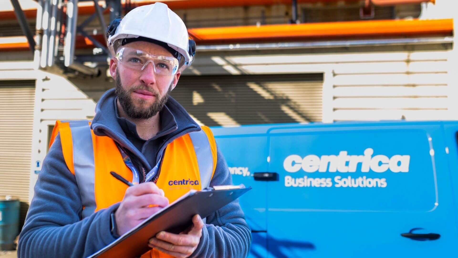 Centrica engineer with hard hat and clipboard