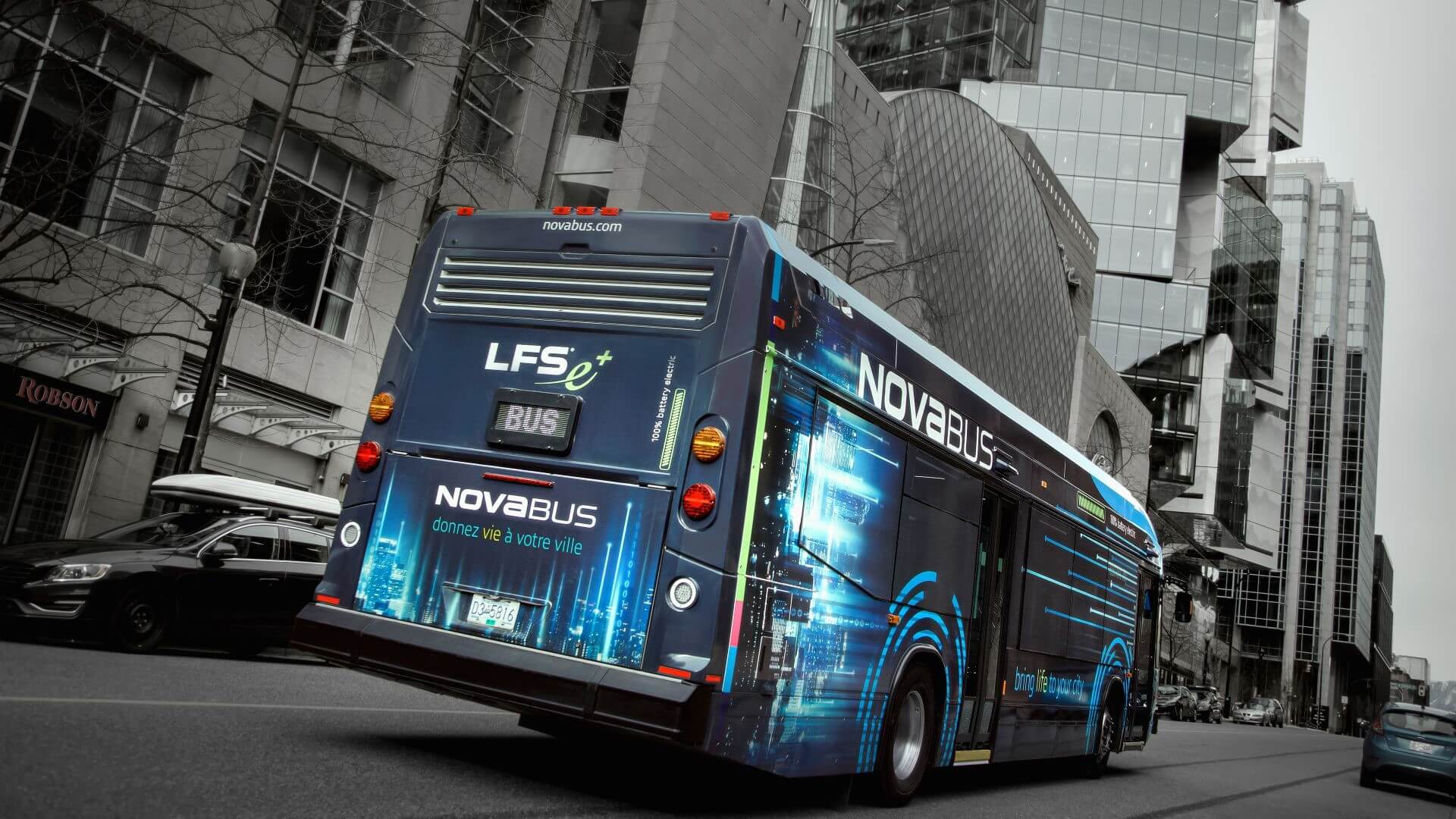 Nova Bus driving through city 