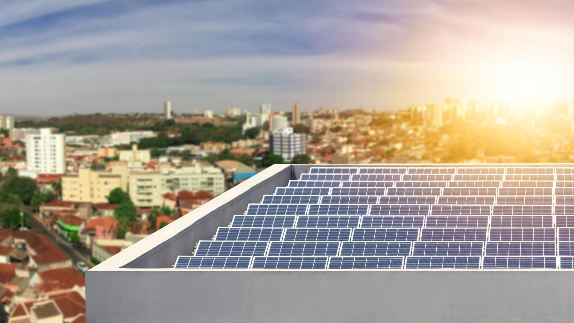 Solar panels on roof against a city background