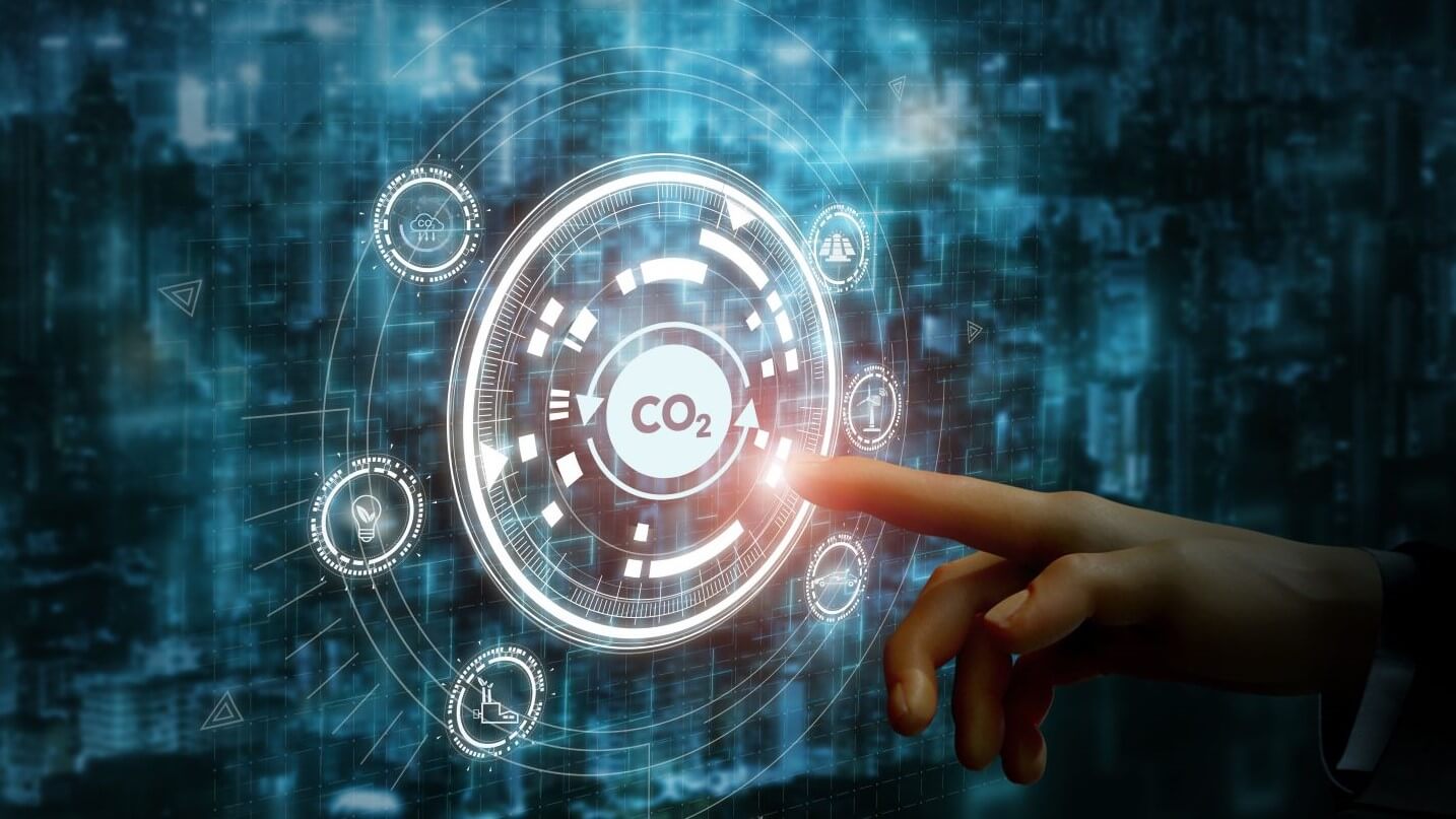 Graphic of a hand touching a dial with a CO2 sign