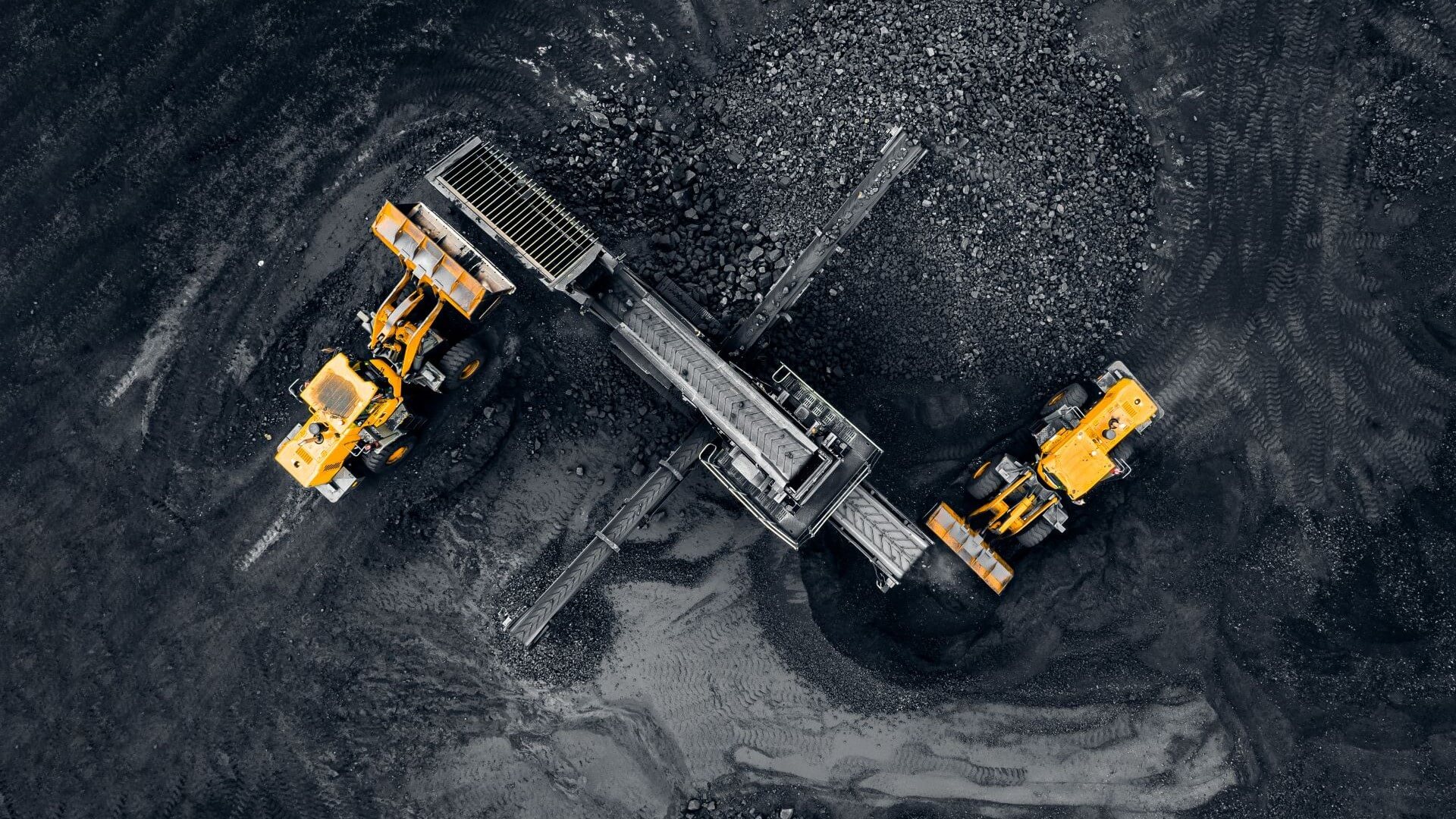 Aerial view of vehicles in a coal mine
