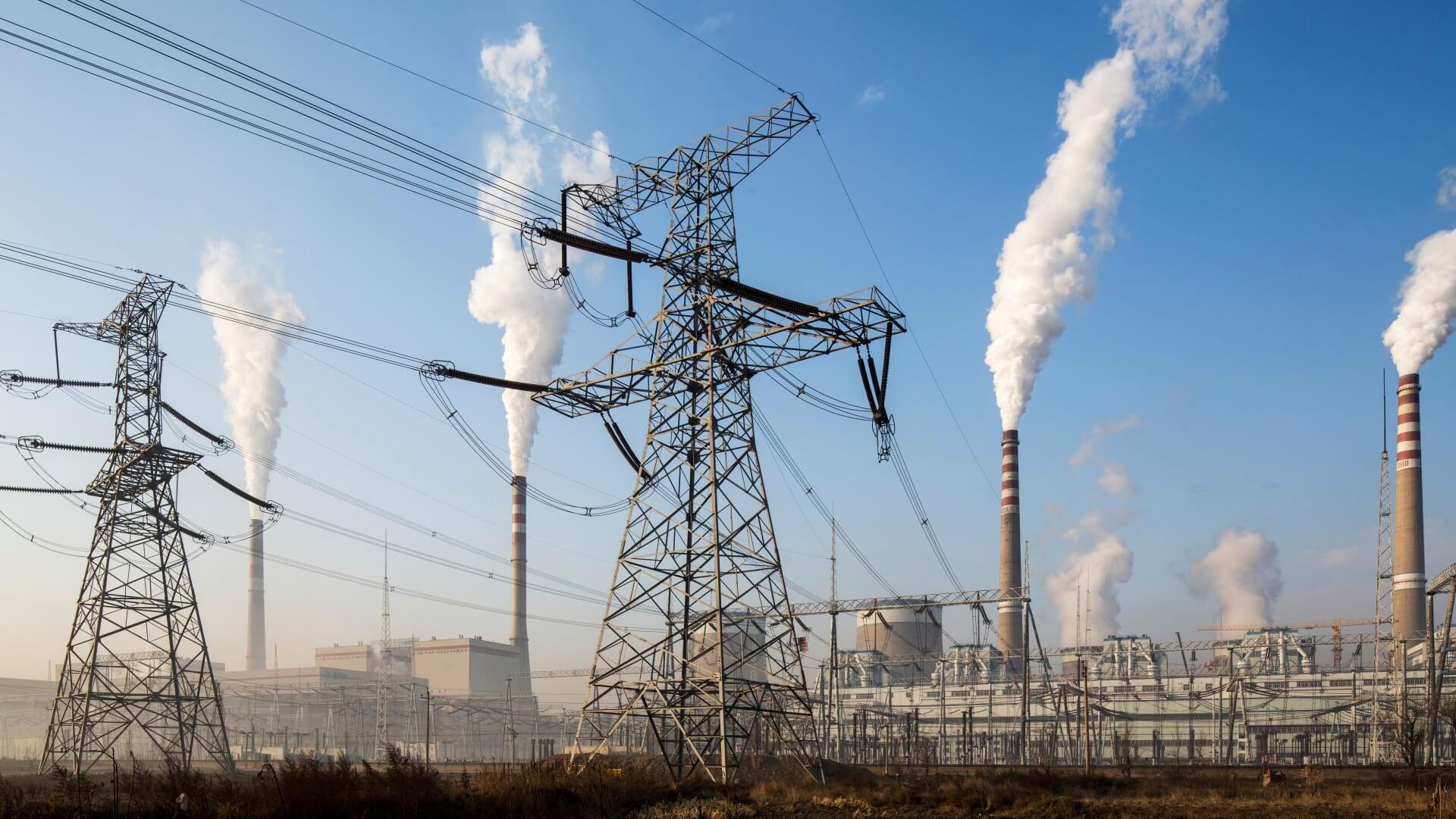 View of coal-fired power station and electricity transmission lines in China