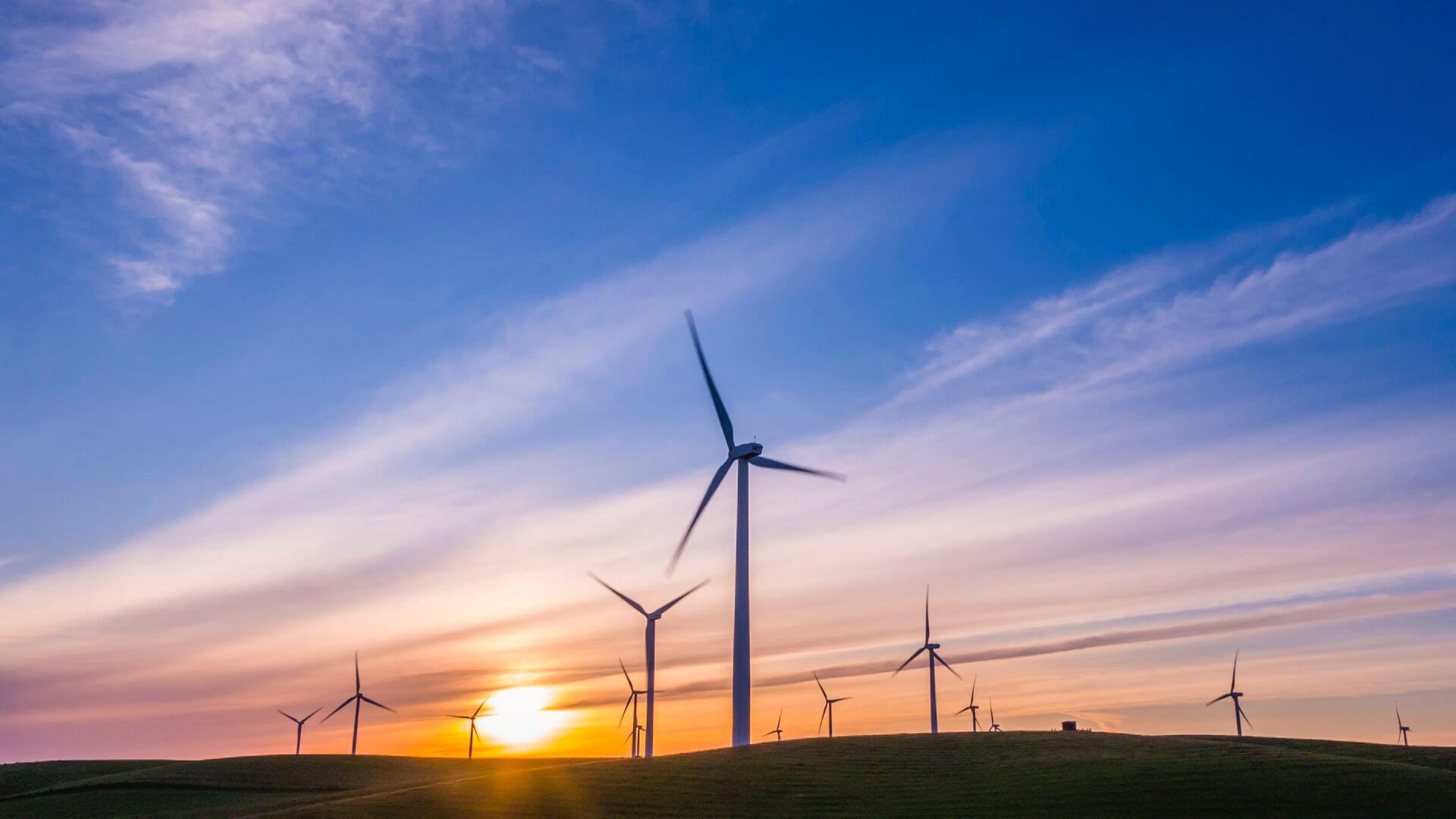 Onshore wind turbines at sunset