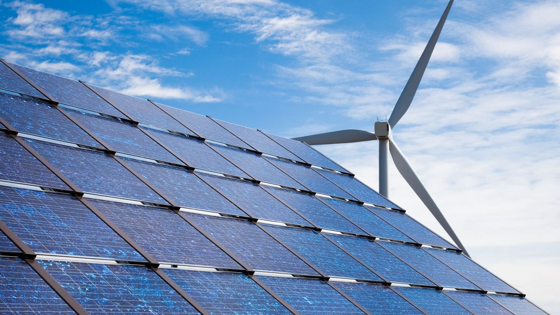 Wind turbine and solar panel close up