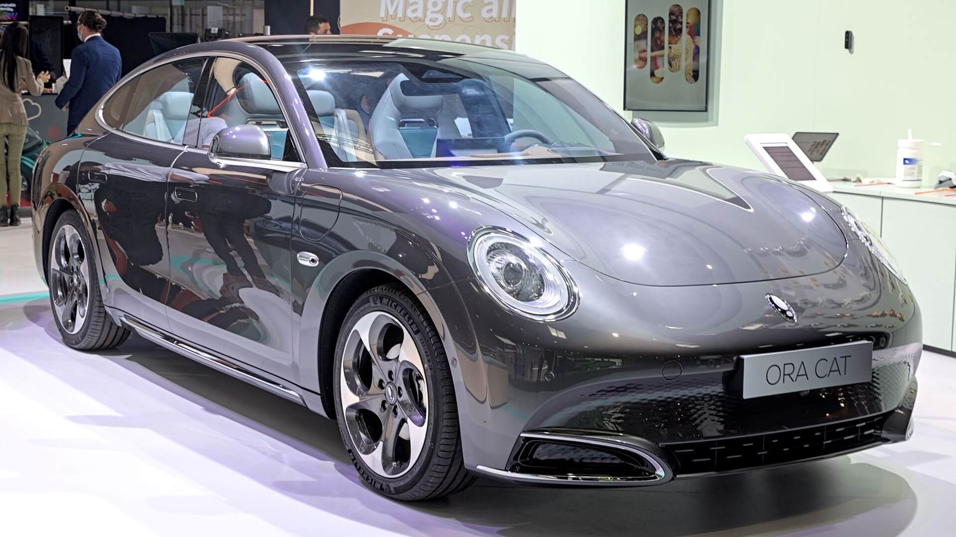 Sleek new electric vehicle displayed on exhibition stand