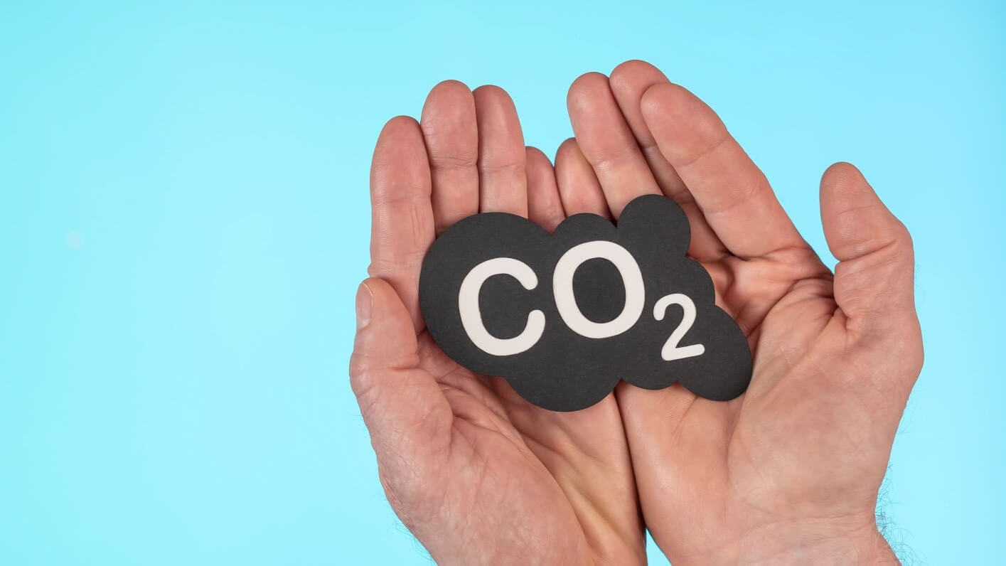 Hands holding tightly a CO2 sign