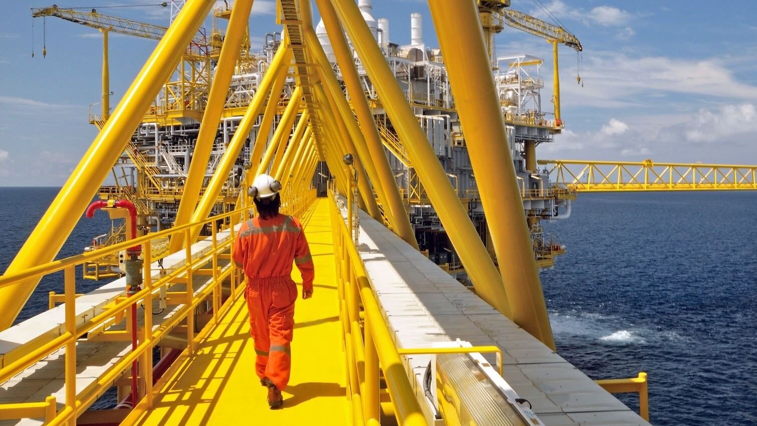 Engineer on offshore platform walkway