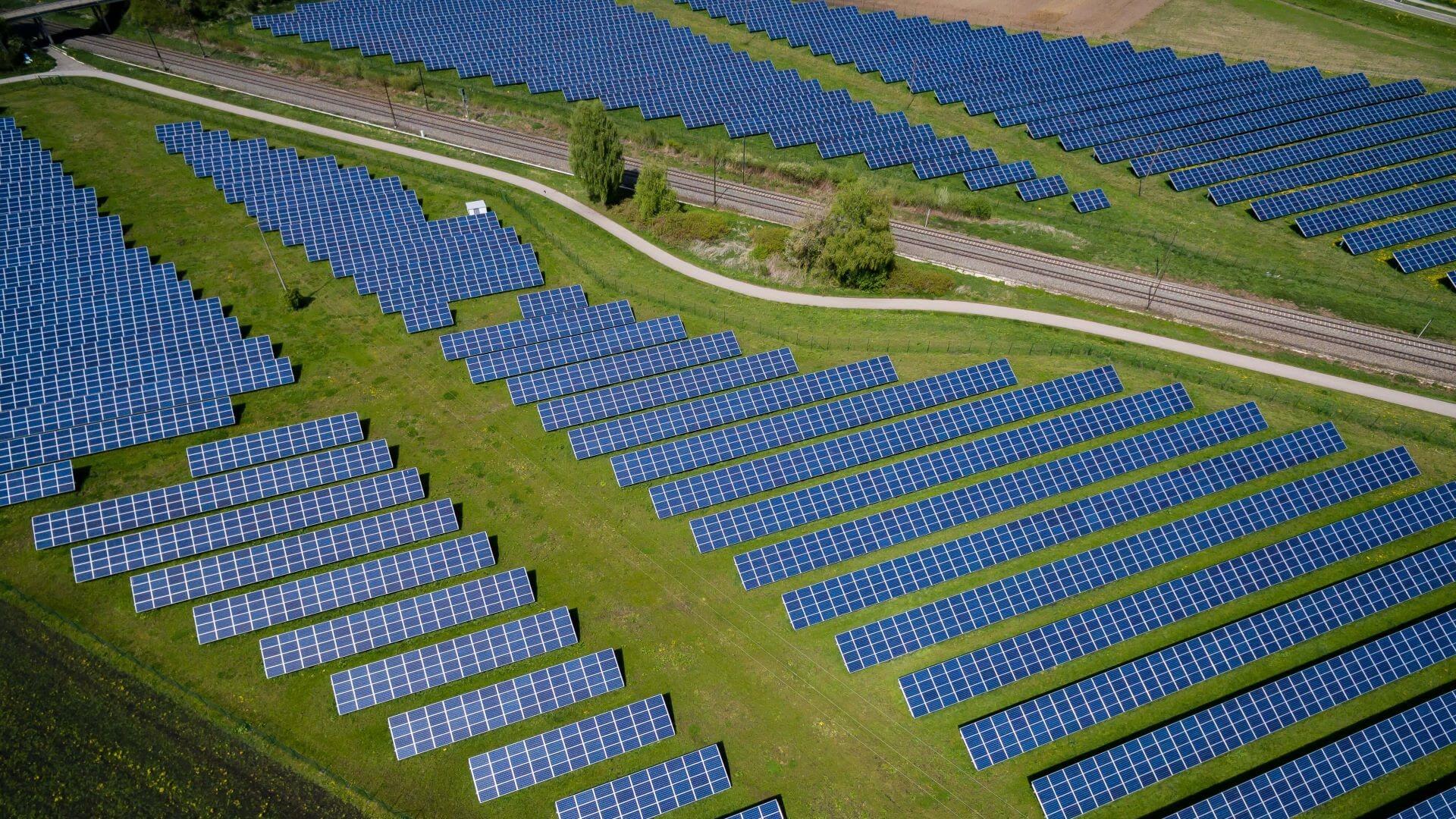 Aerial view over row upon row of solar panels