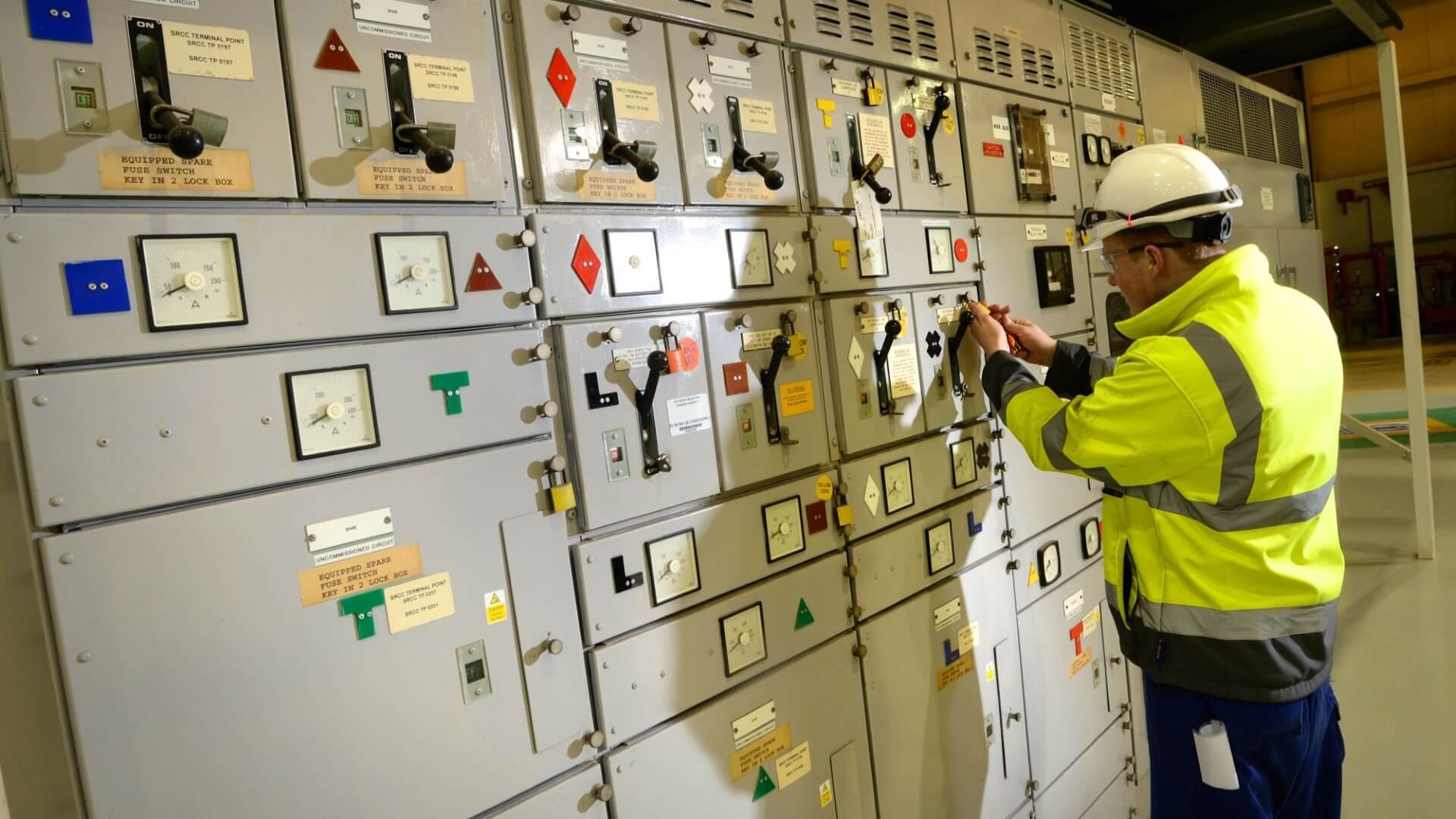 Engineer operating controls at Heysham 1 nuclear power plant