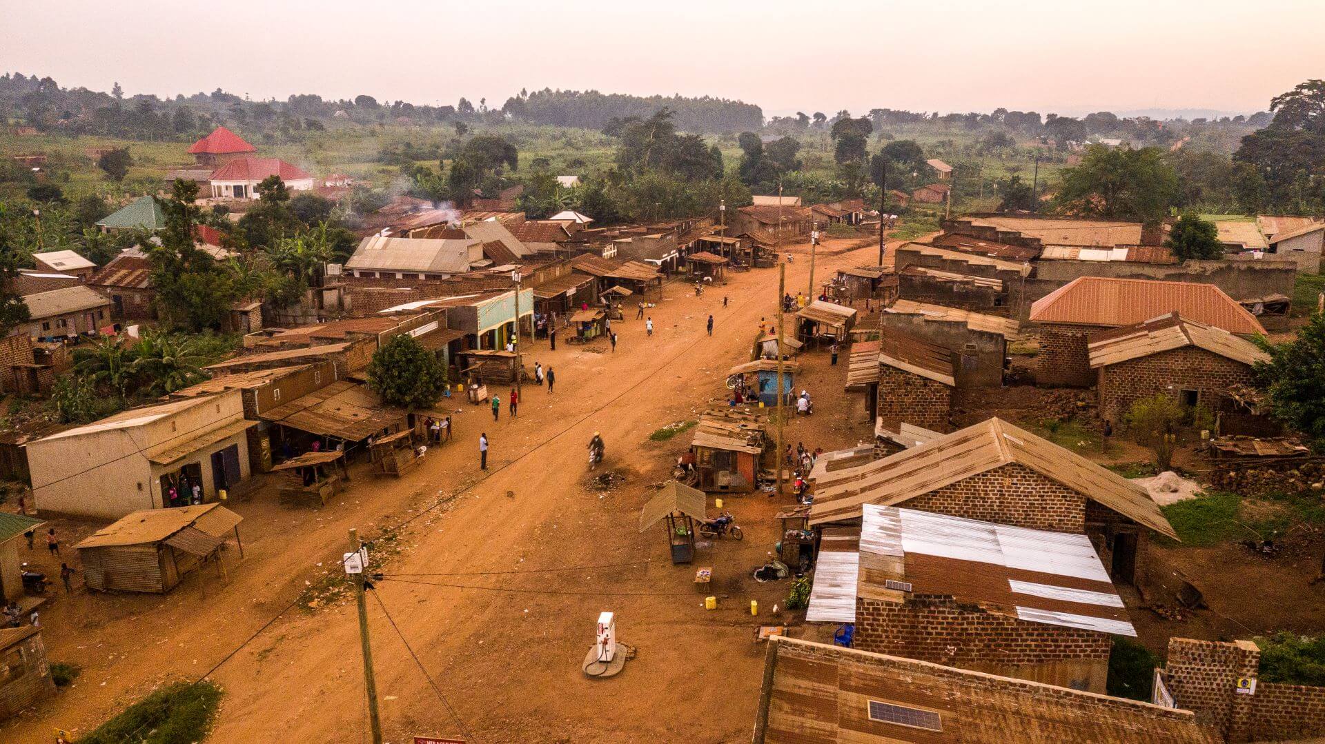 Aerial view over Ugandan village, buildings and through road