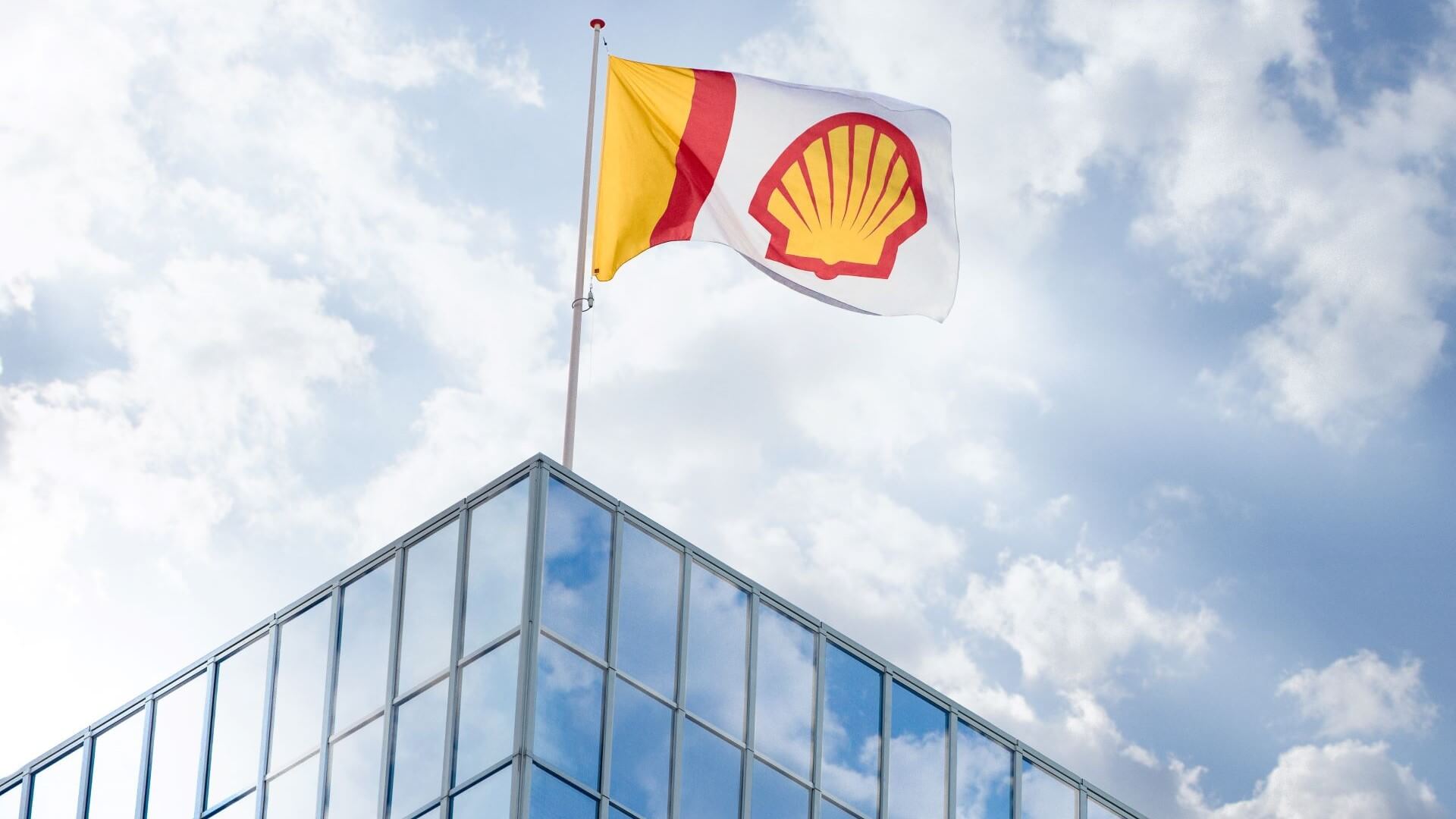 Shell logo on flag flying over building