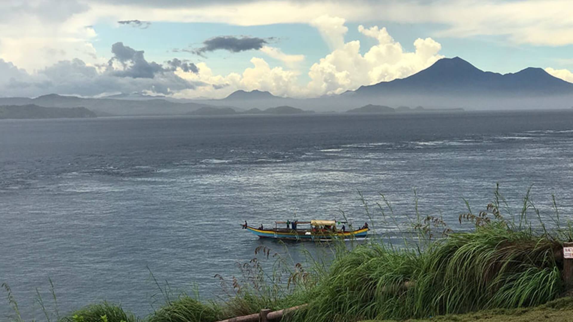 View off Capul Island of a boat on the San Bernardino Strait
