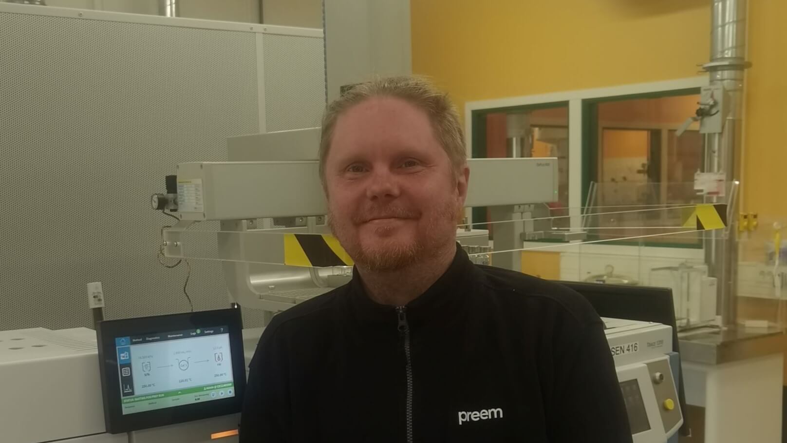 Head and shoulders photo of Mattias Gustafsson with lab equipment in the background