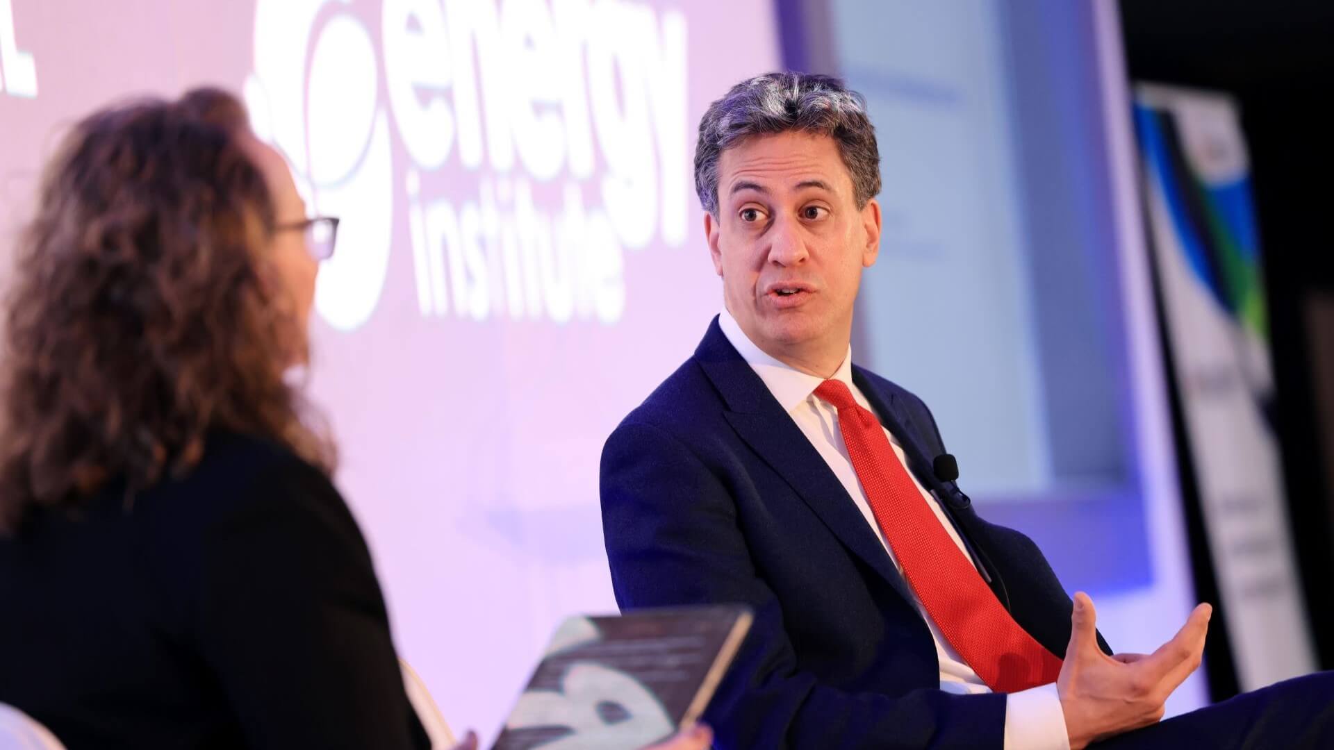 Ed Miliband, MP for Doncaster North, sat in chair on stage, in conversation with EI President Juliet Davenport, also sat in a chair on stage
