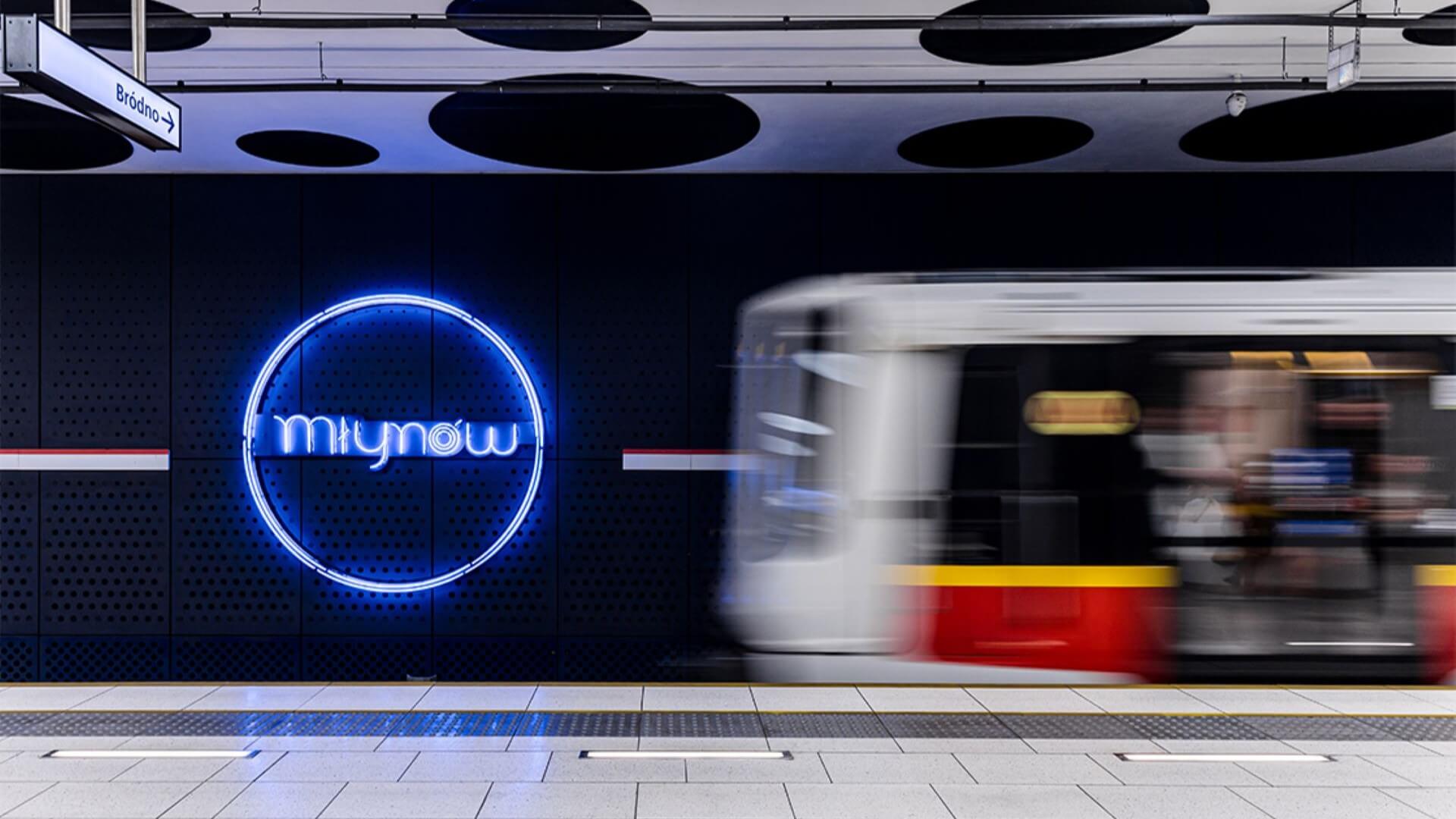 Blurred image of metro train speeding right to left along underground platform