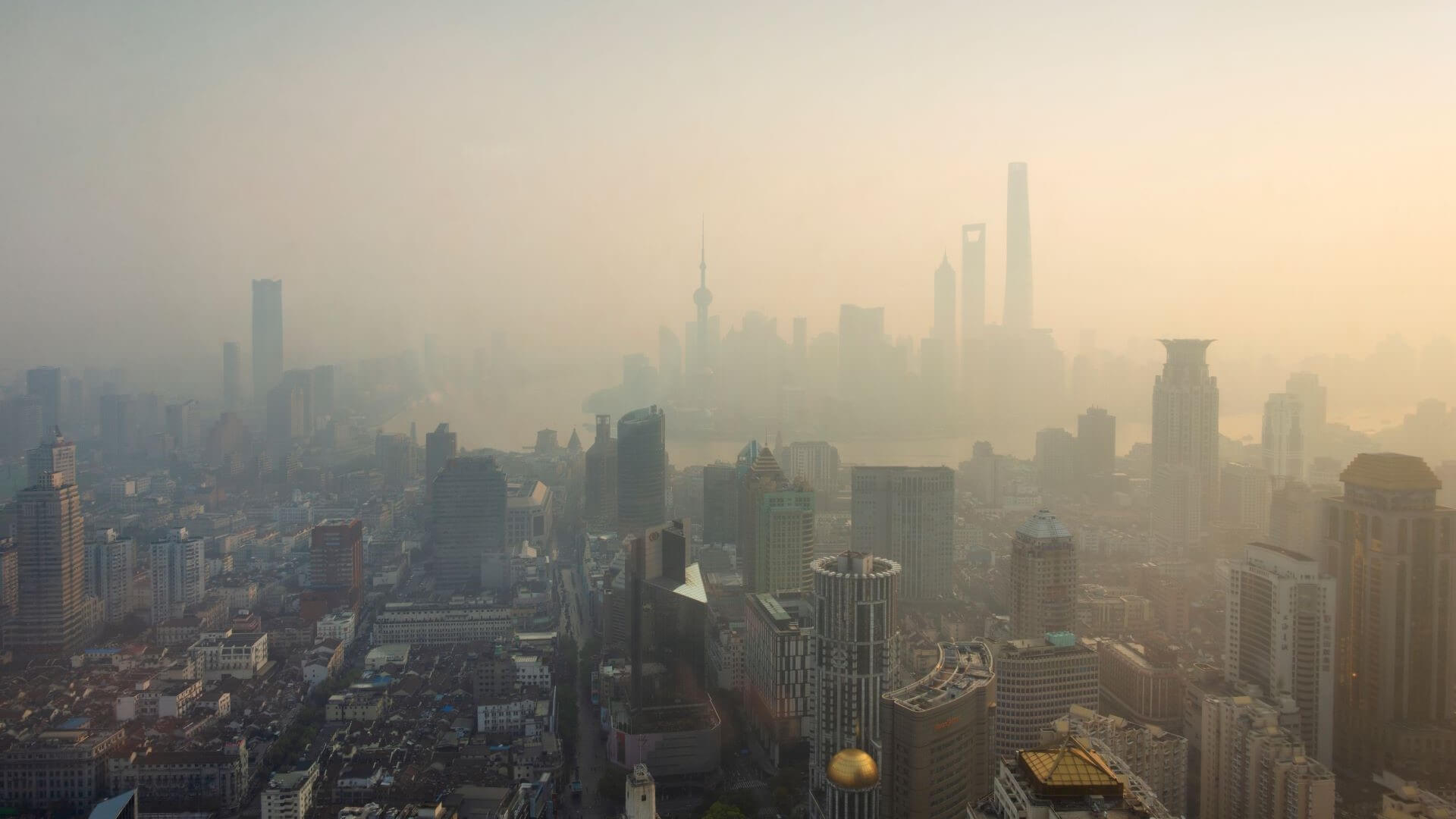 Aerial view over Chinese city of Shanghai, hazy and covered in smog 