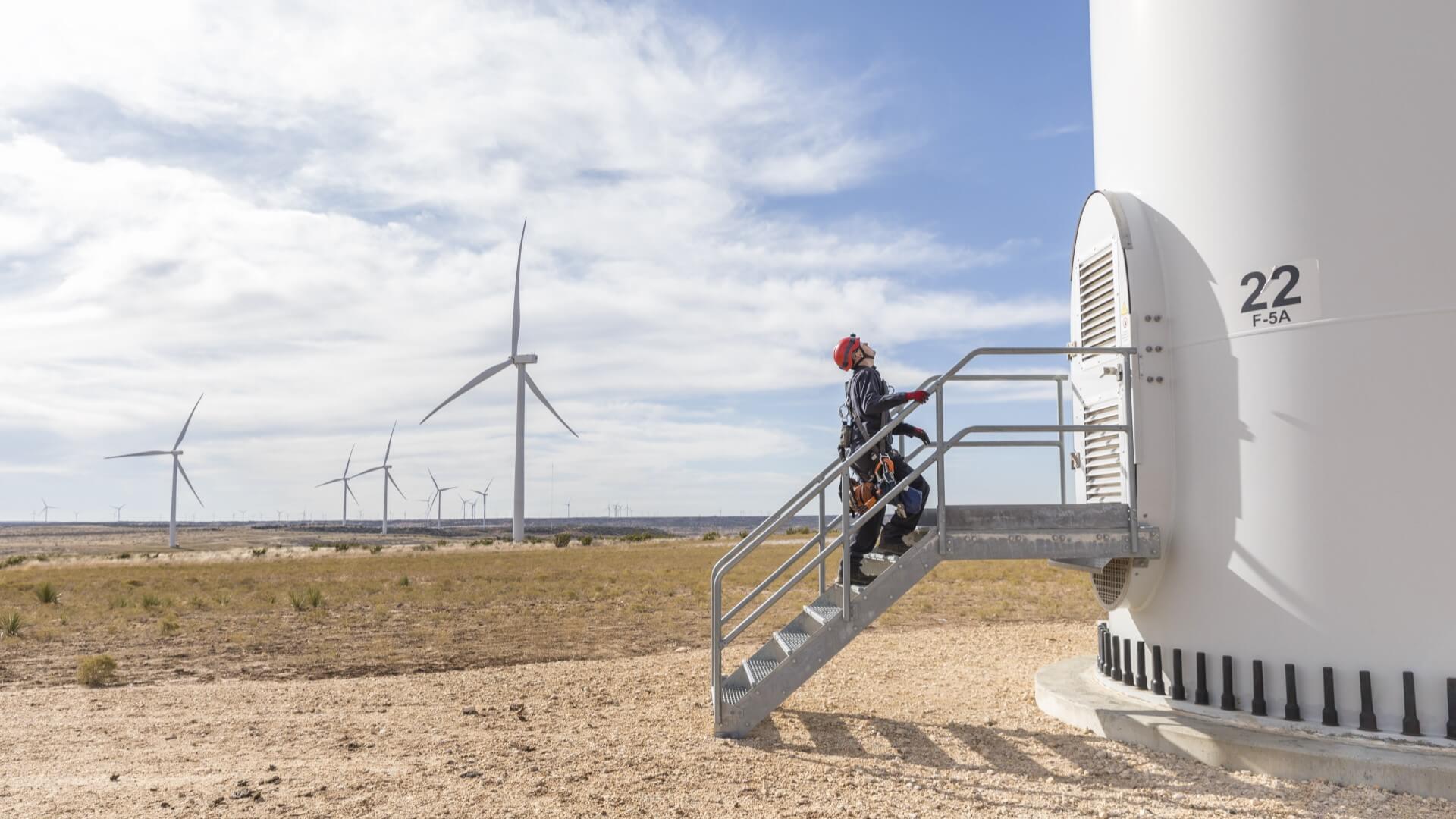 Engineer at base of onshore wind turbine