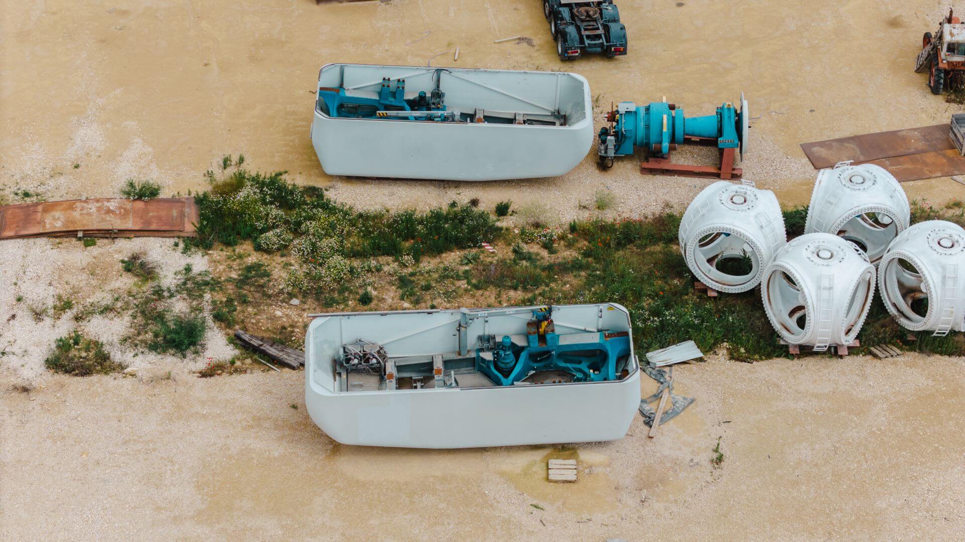 Aerial view of bits of dismantled wind turbine awaiting recycling