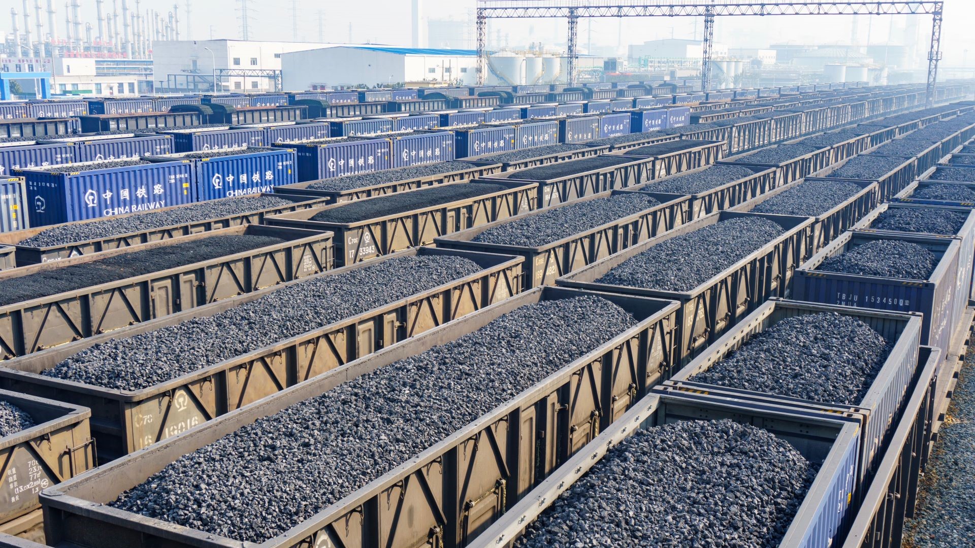 Rows of rail freight containers full of coal
